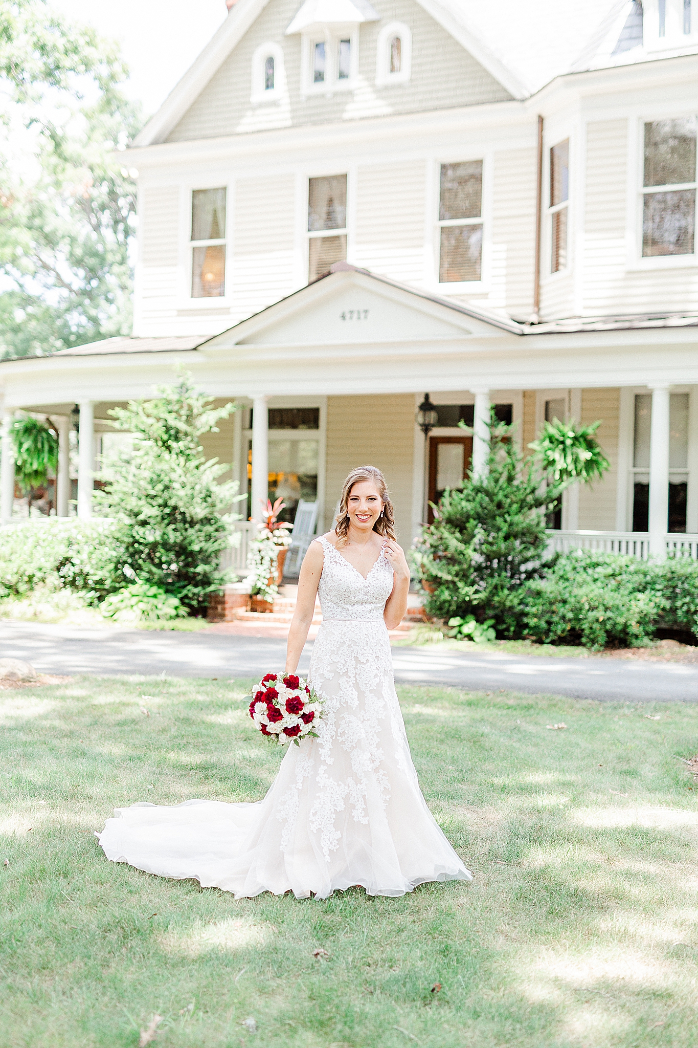 bride poses outside Alexander Homestead