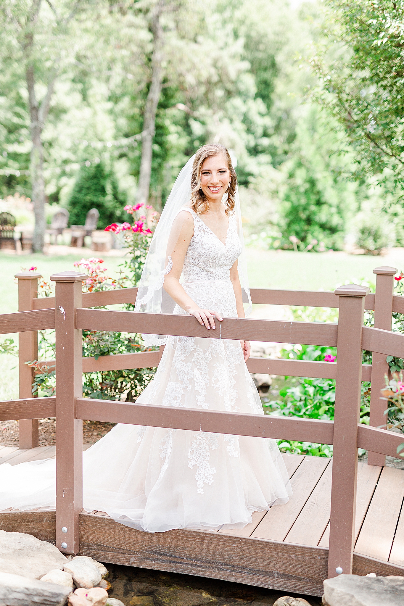 bride walks on bridge at Alexander Homestead