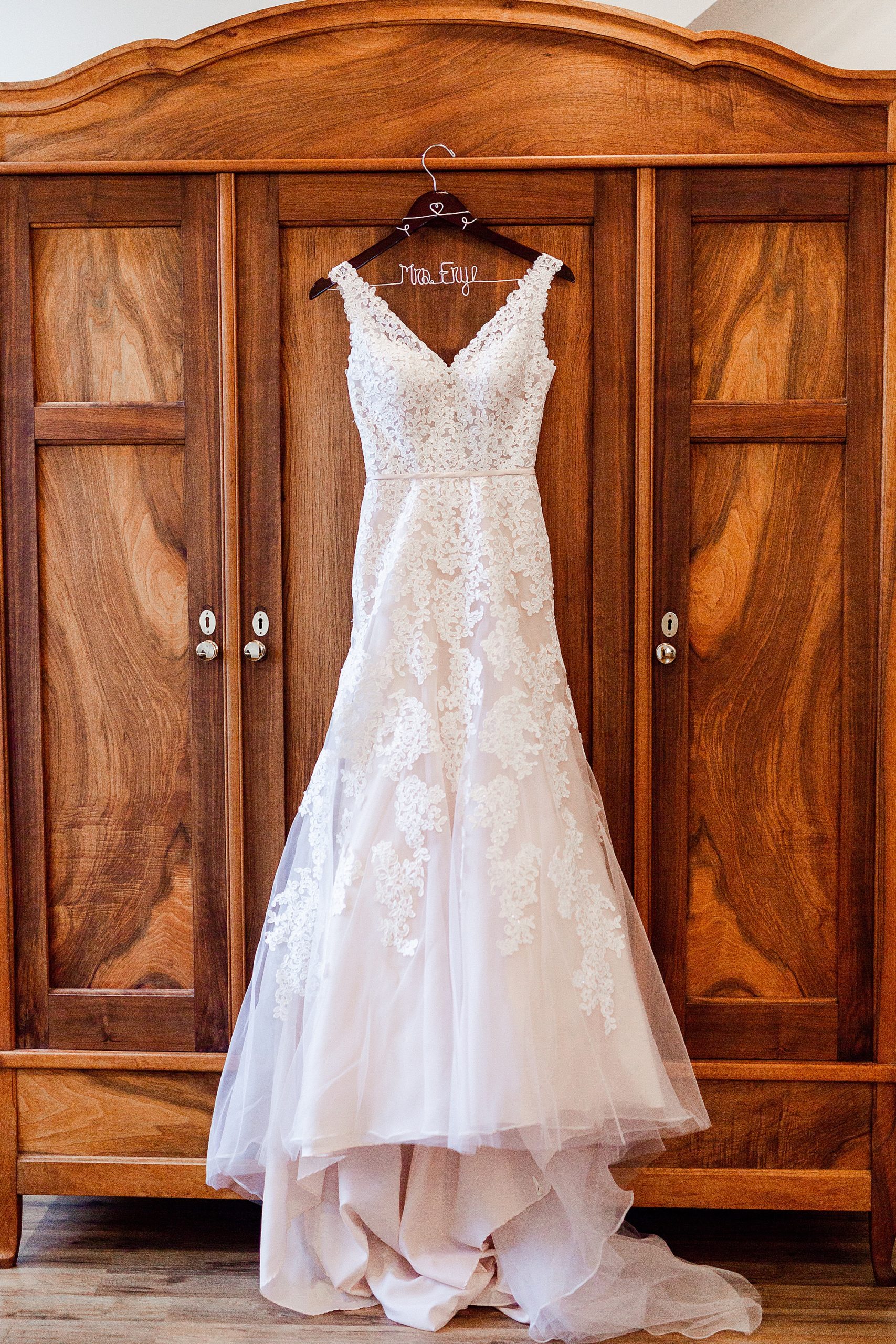 wedding dress hangs in bridal suite at Alexander Homestead