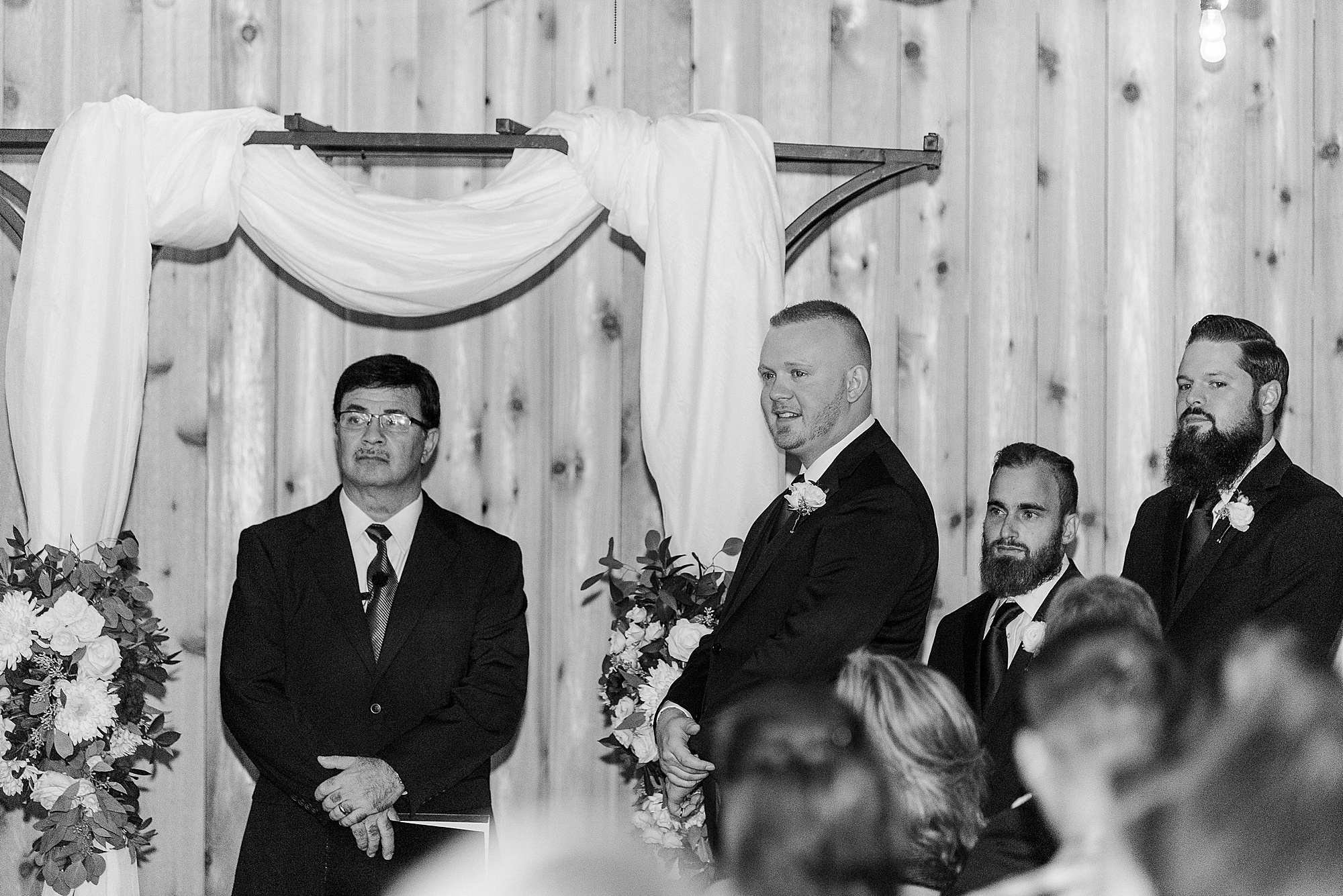 groom watches bride walk down aisle at Alexander Homestead