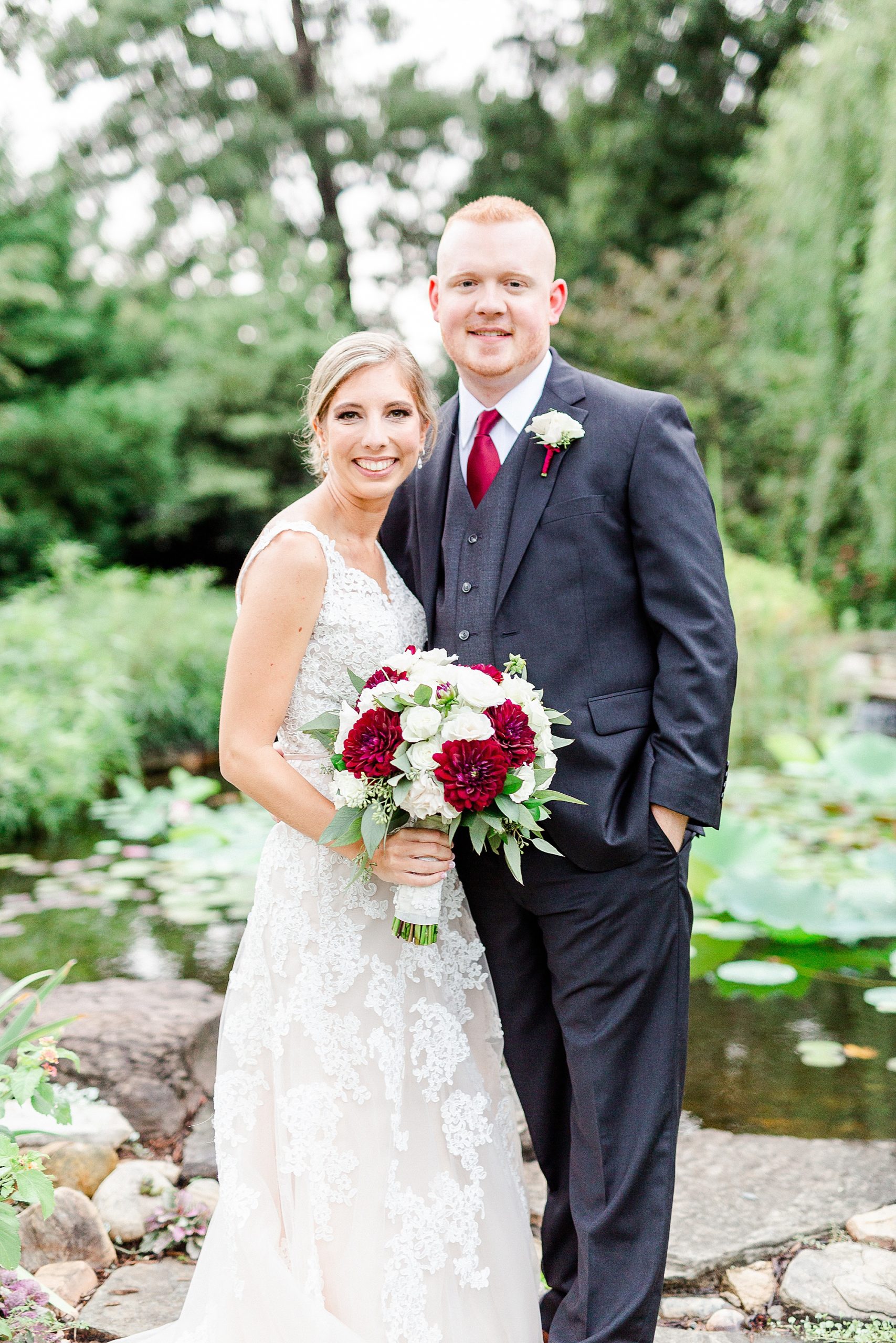 couple poses during summer wedding photos