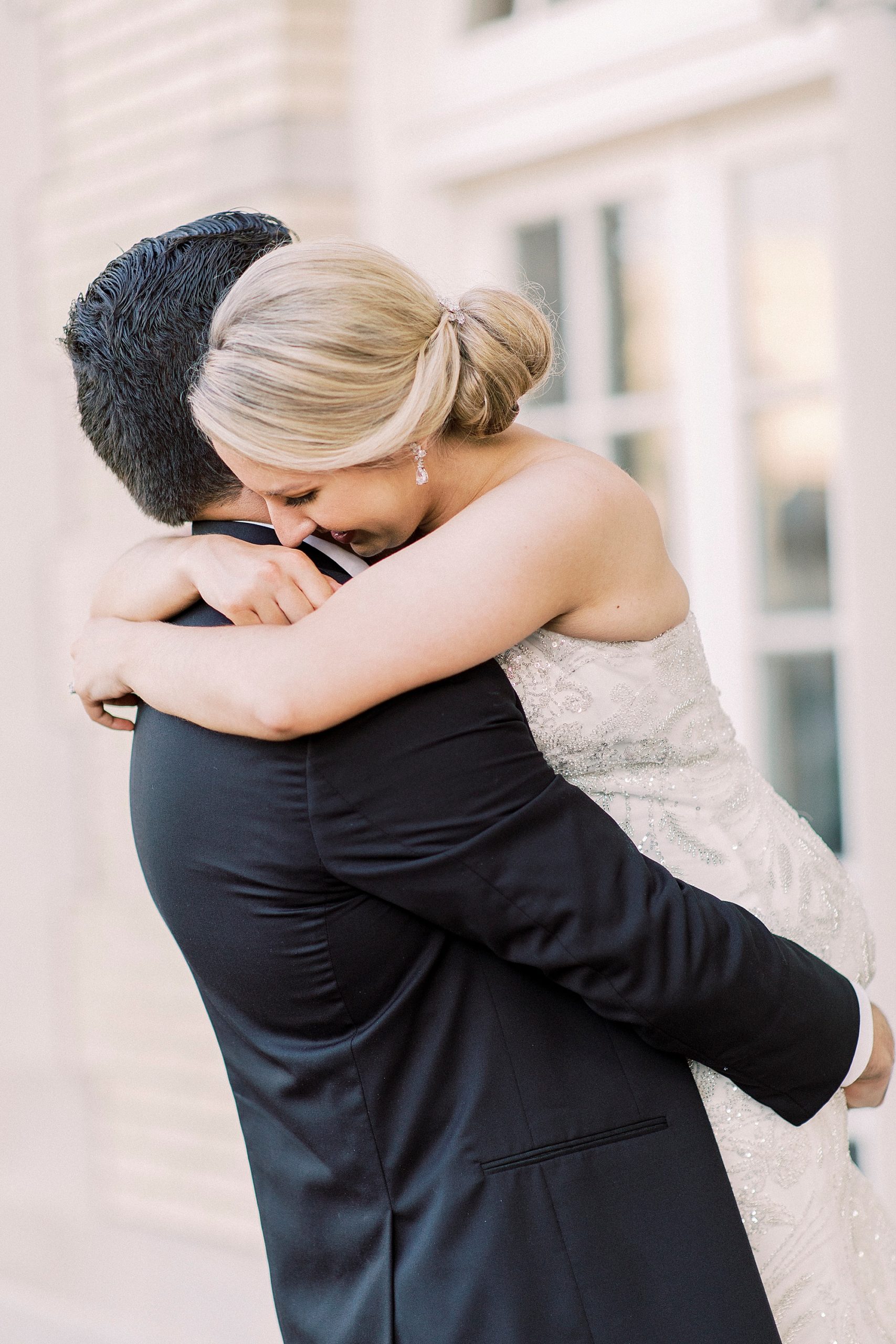 bride and groom hug during photos in Charlotte NC