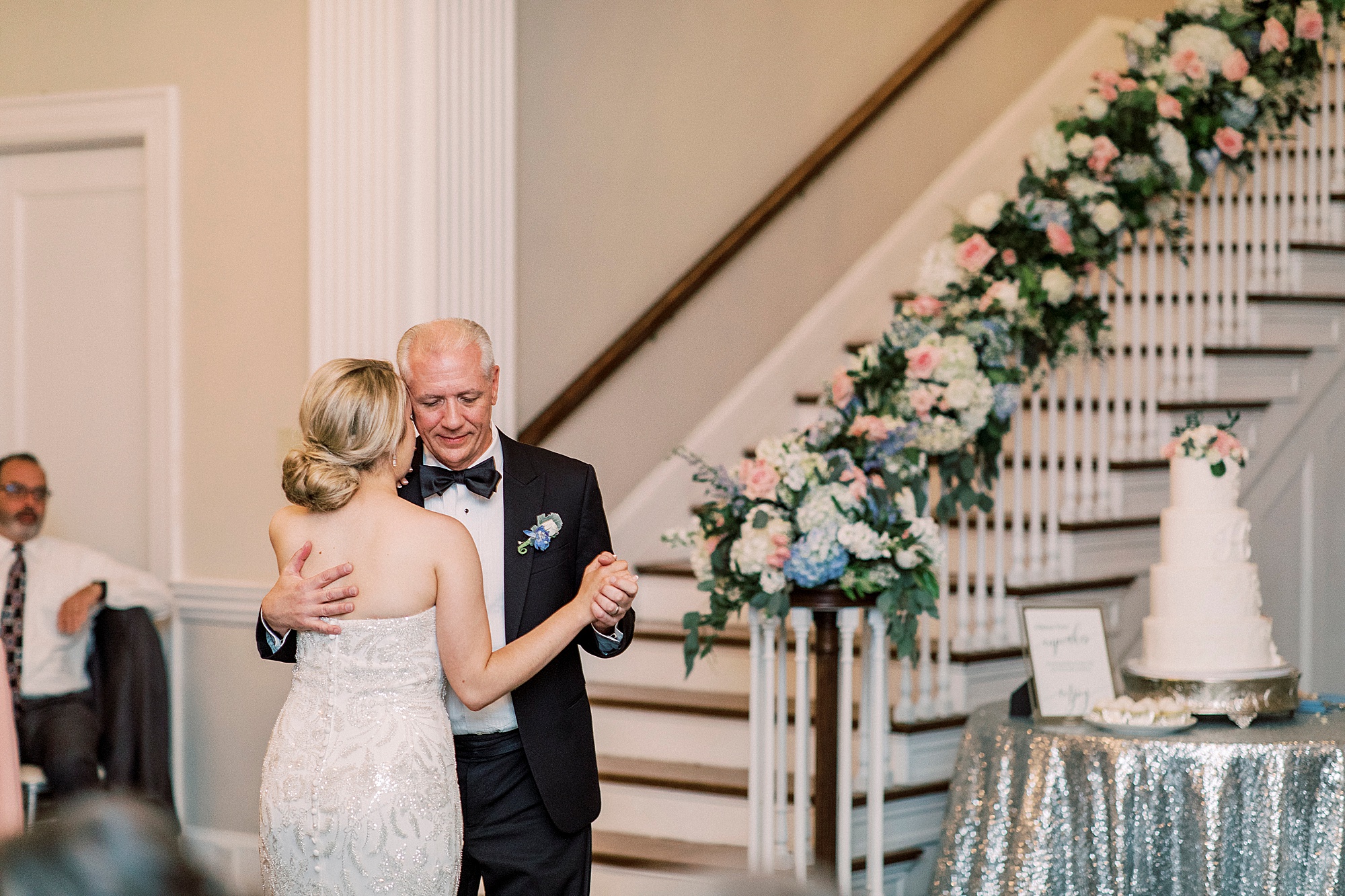 bride dances with dad during wedding reception