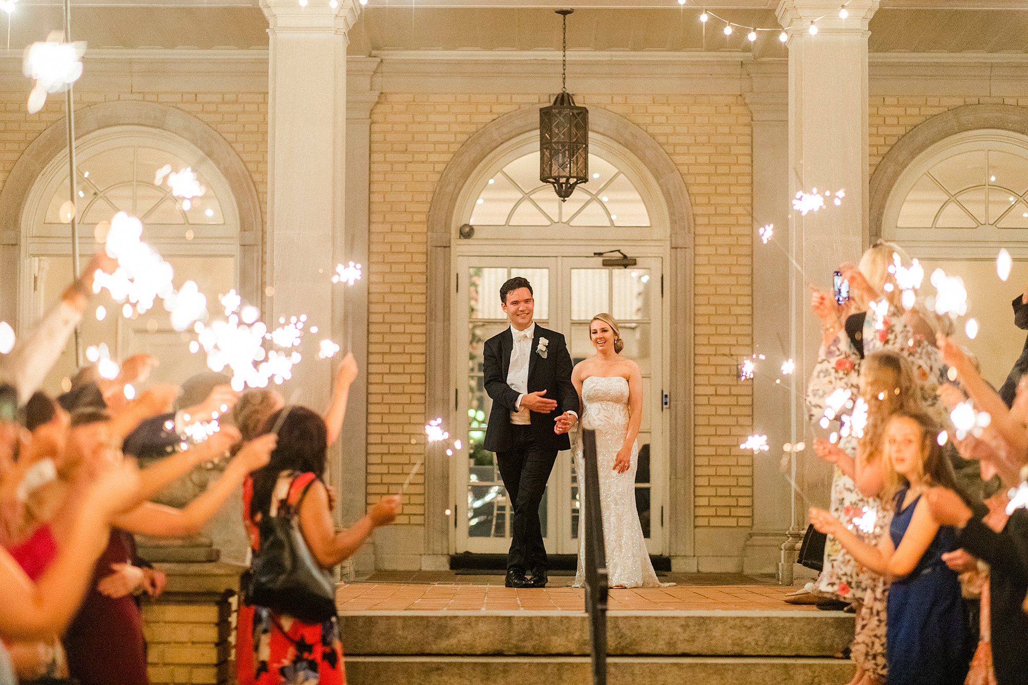 married couple leaves Separk Mansion during sparkler exit