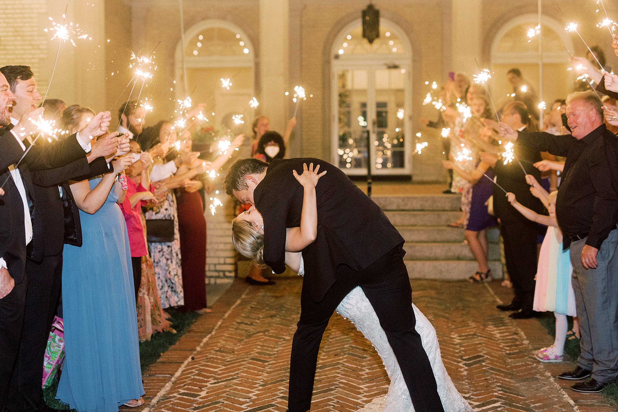 bride and groom kiss outside Separk Mansion