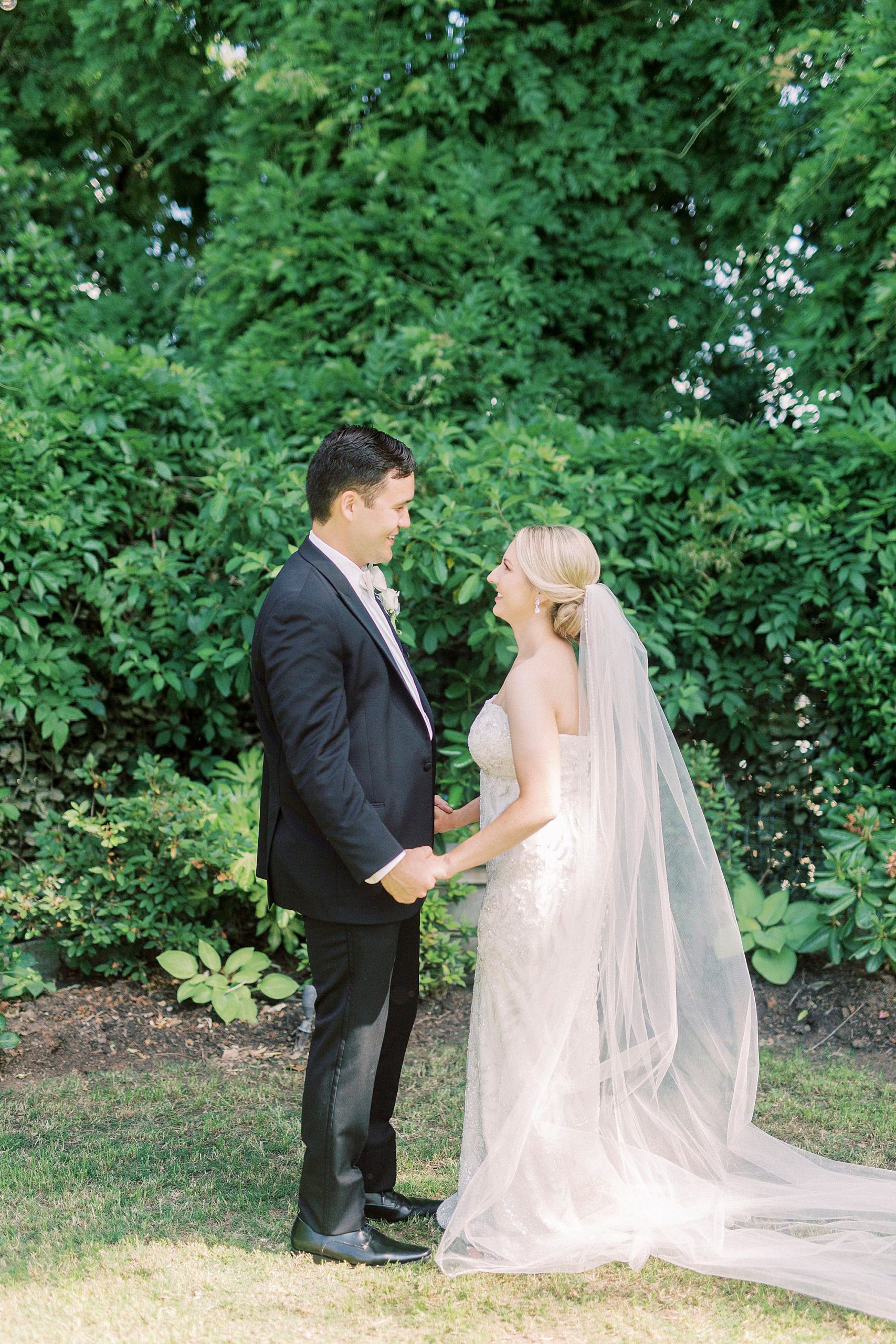 bride and groom look at each other during first look