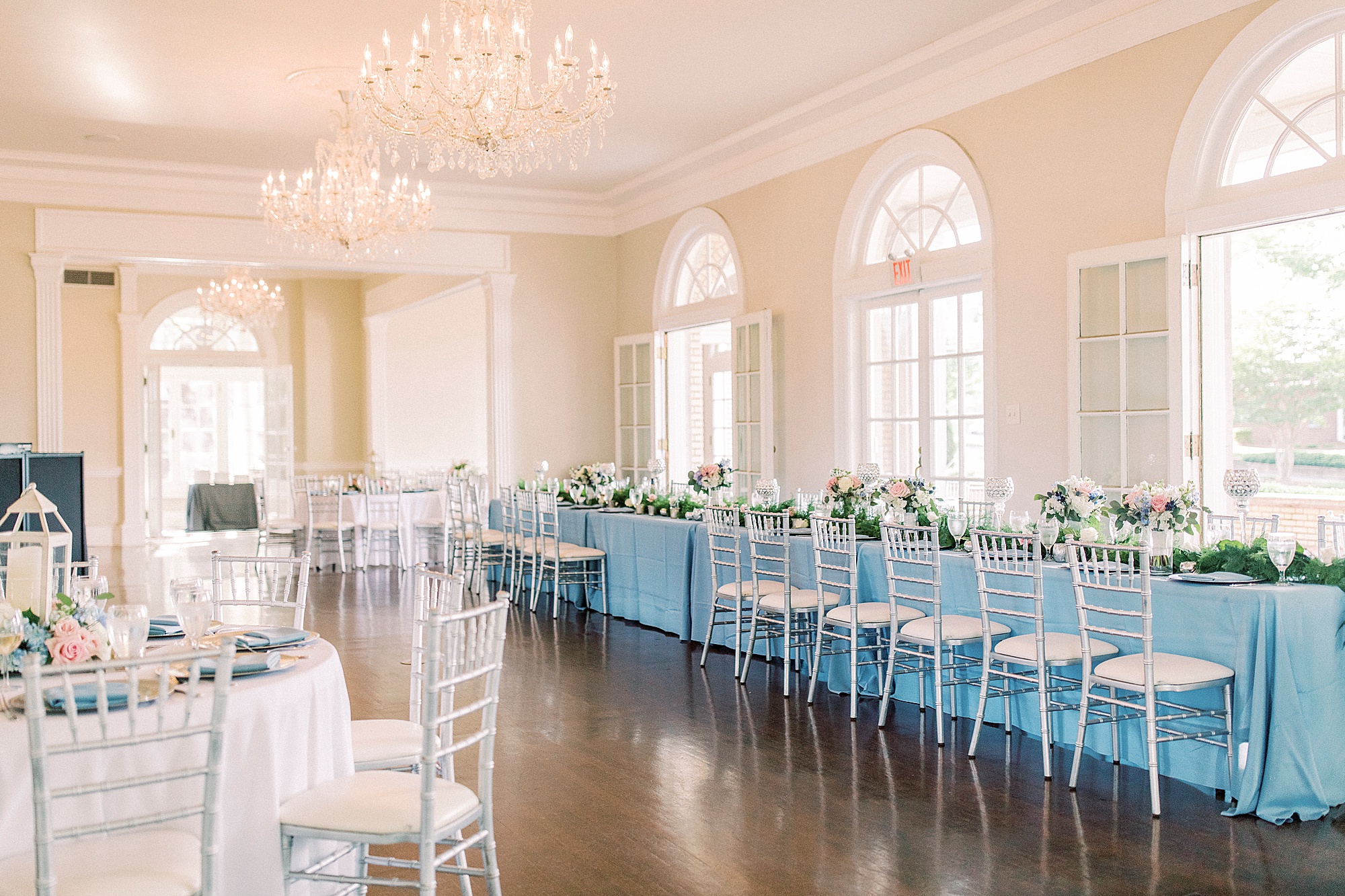 elegant Charlotte wedding reception with blue tablecloths