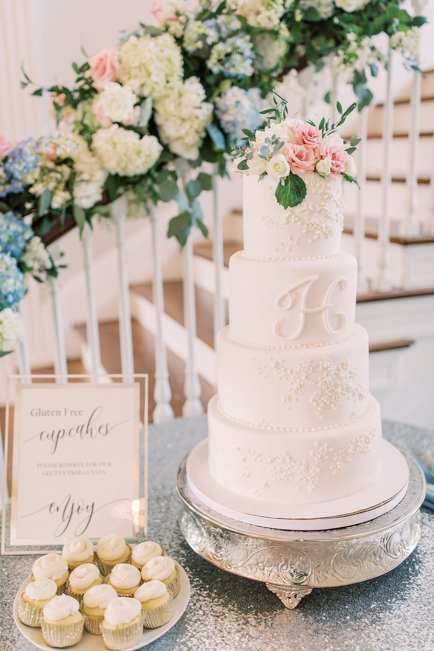 tiered wedding cake by staircase at Separk Mansion