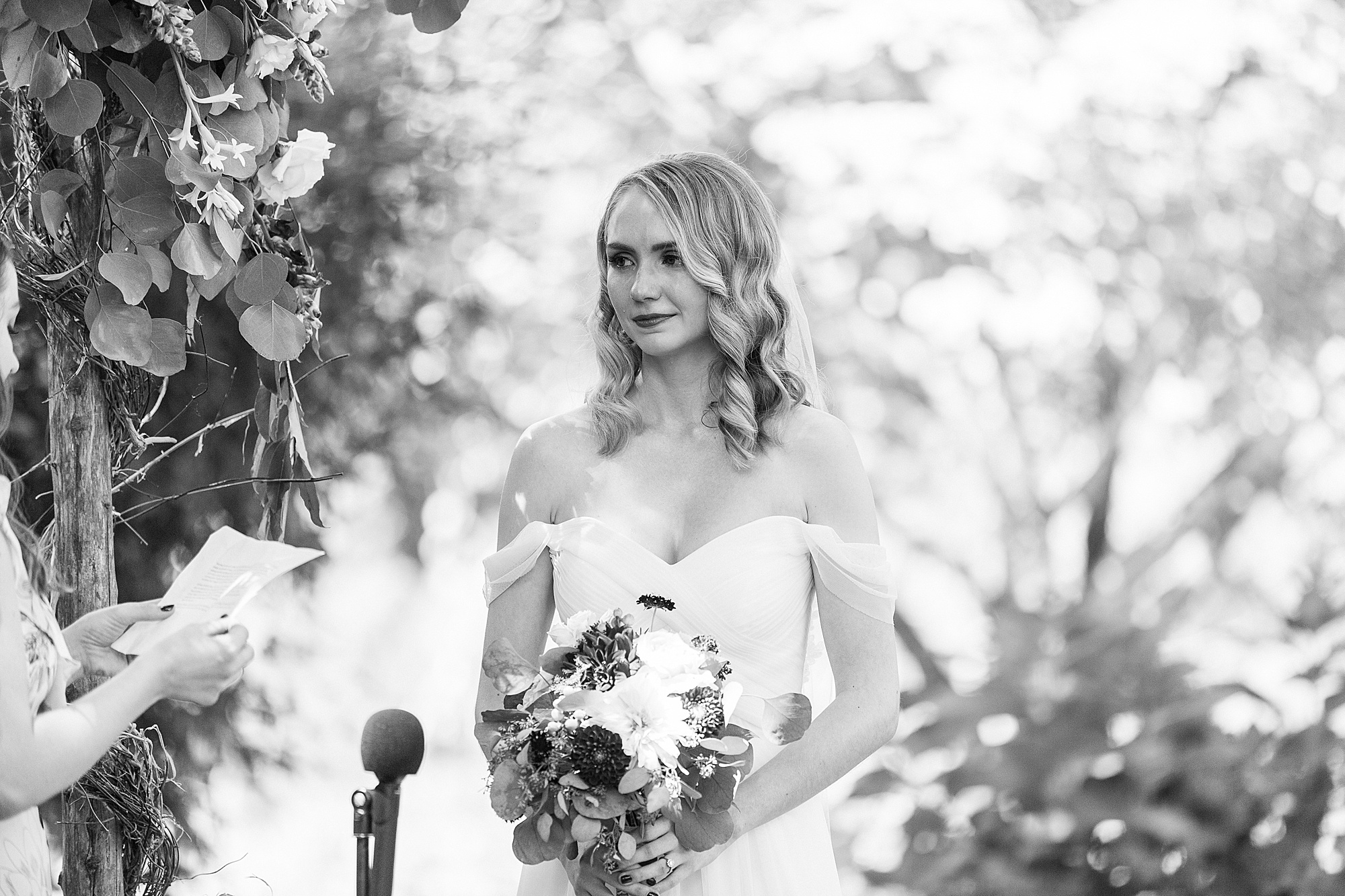 bride listens to ceremony at 1812 Hitching Post