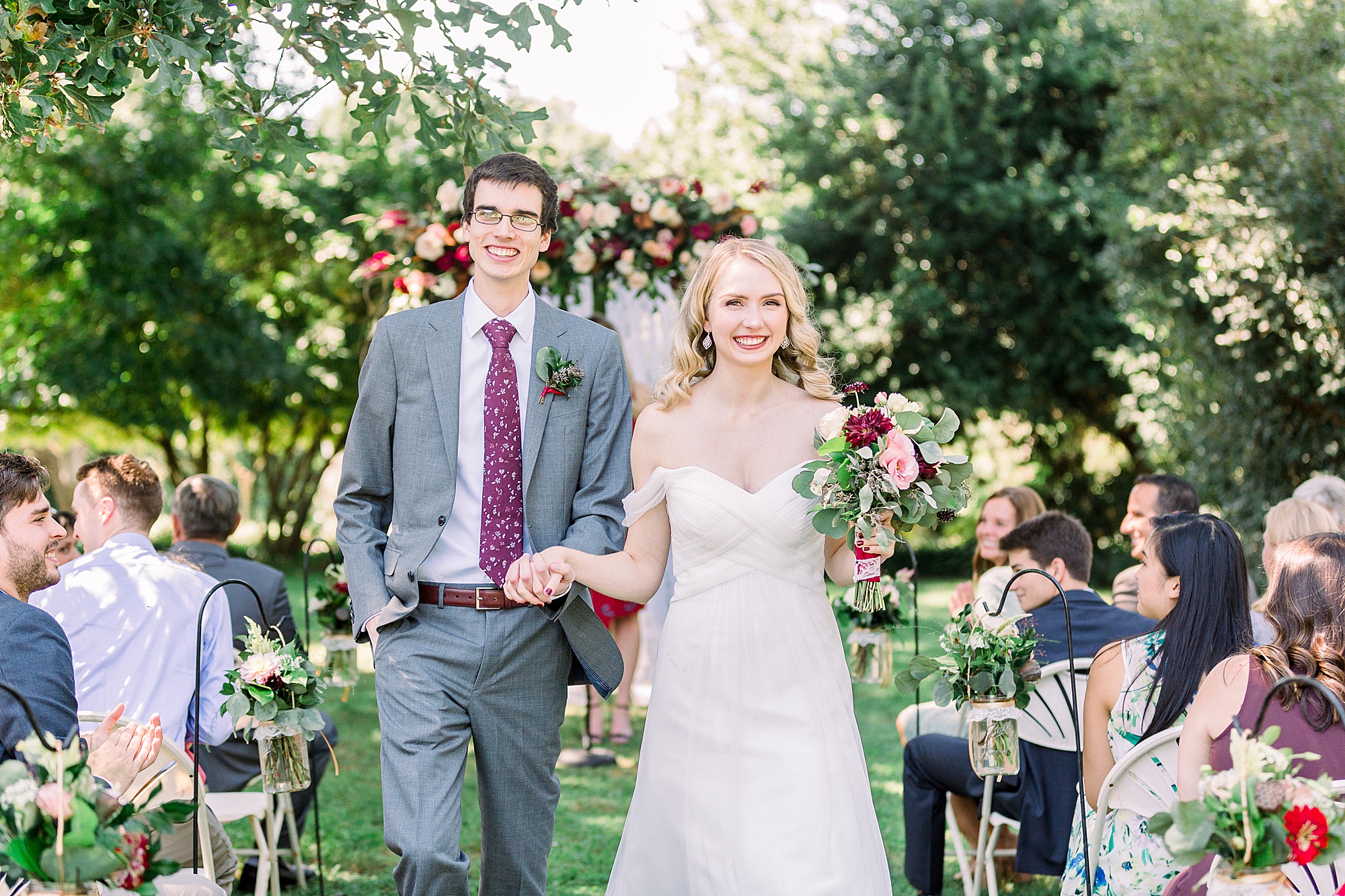 newlyweds leave wedding ceremony at 1812 Hitching Post