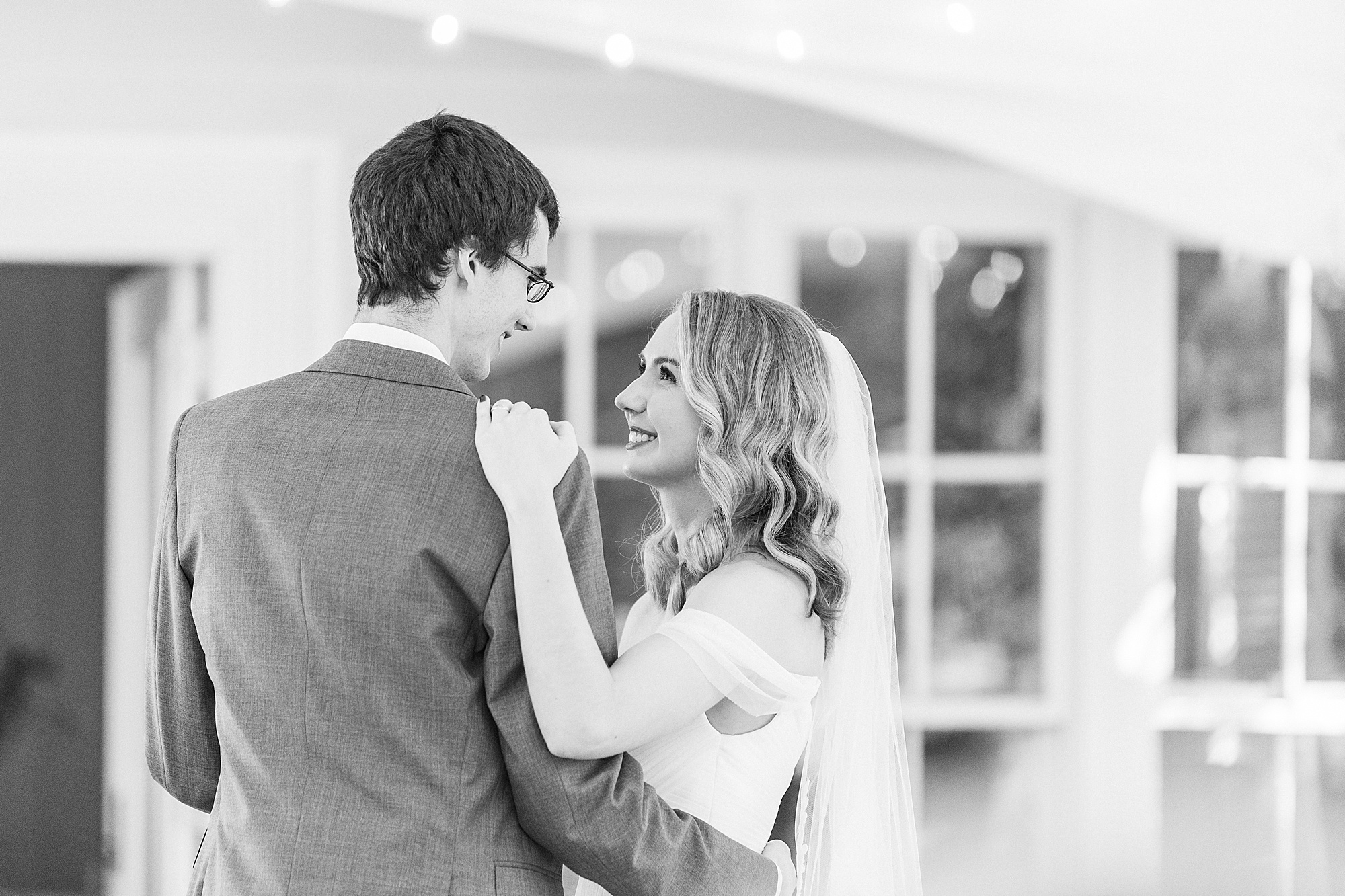 bride and groom dance together at 1812 Hitching Post