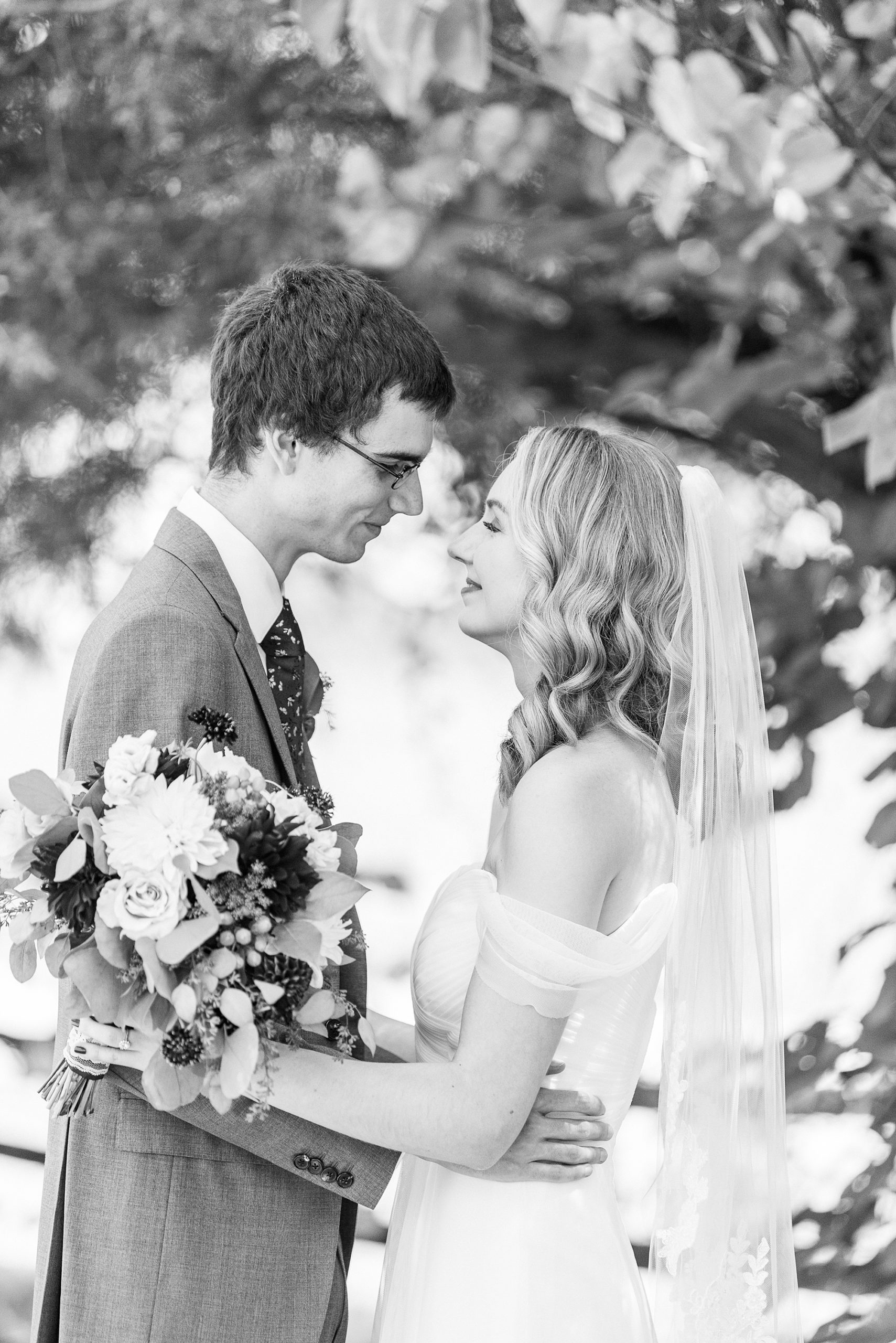 newlyweds pose touching noses at 1812 Hitching Post