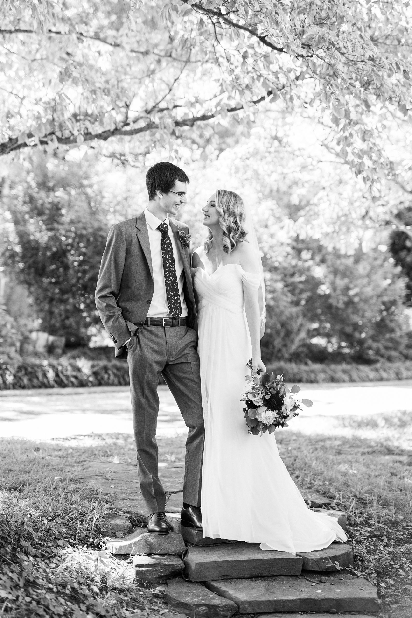 newlyweds pose together during 1812 Hitching Post wedding photos