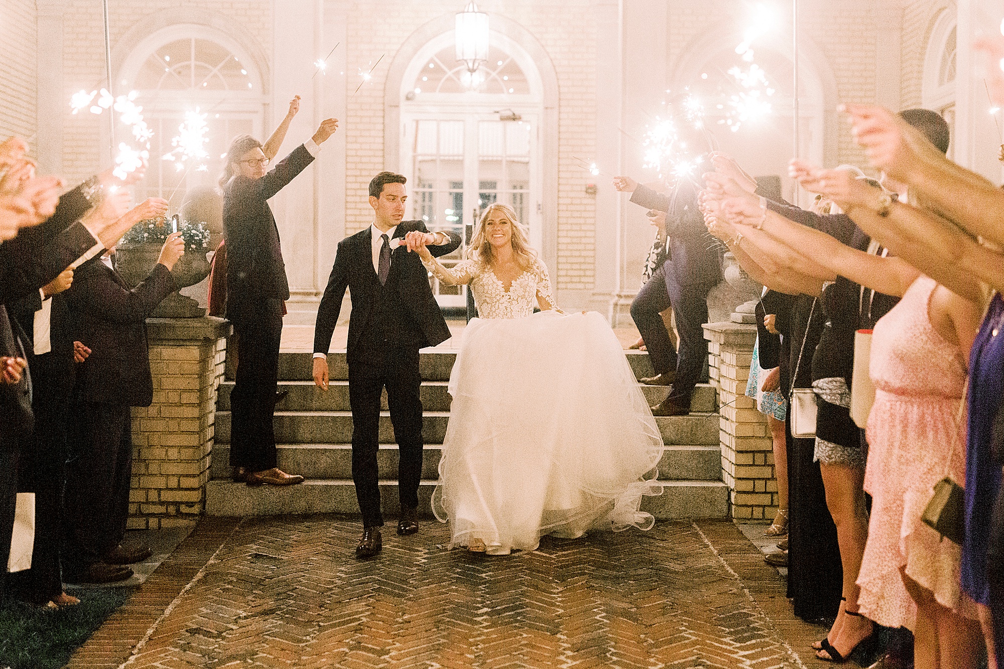 bride and groom leave Separk Mansion during sparkler exit