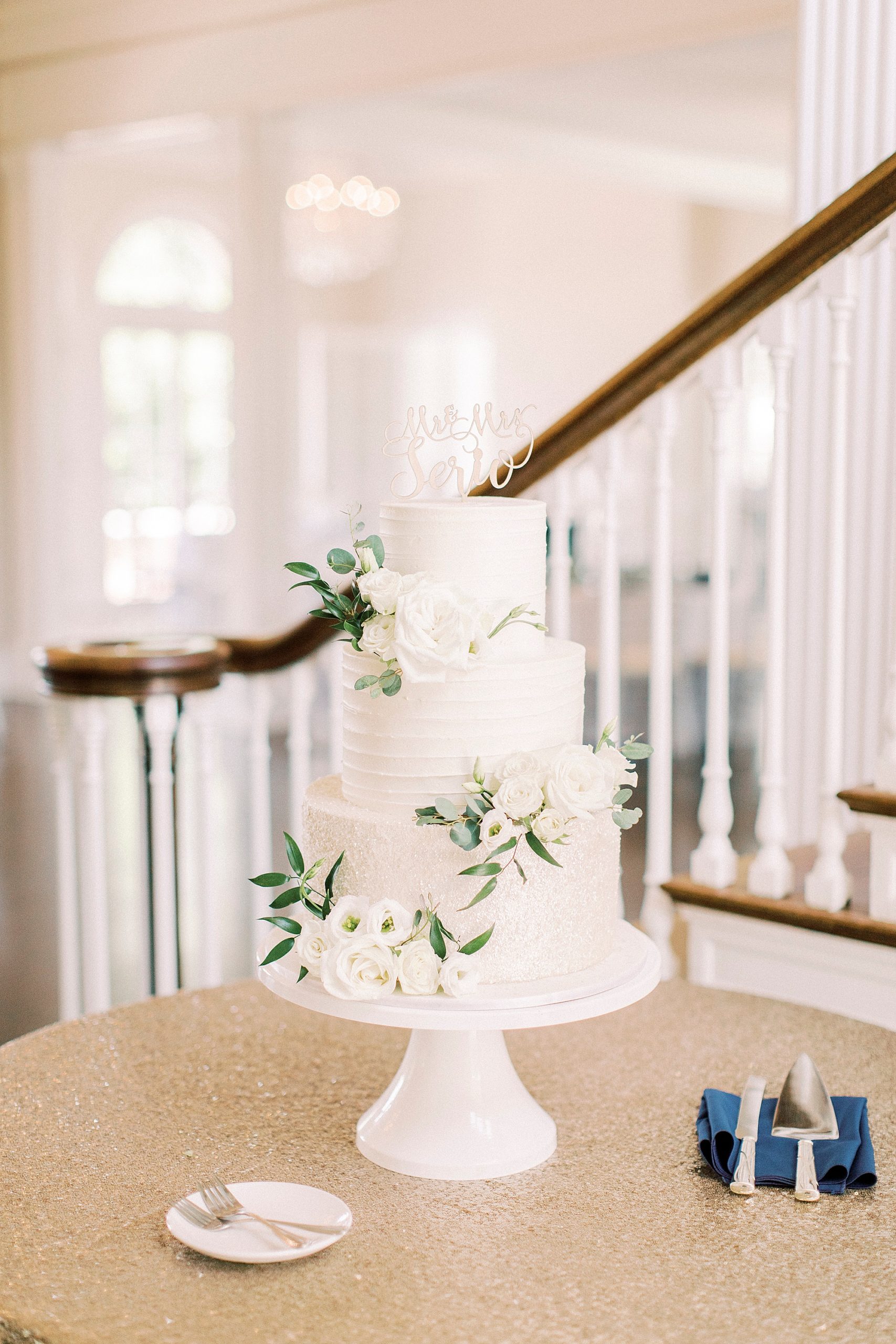 tiered wedding cake at Separk Mansion with floral accents