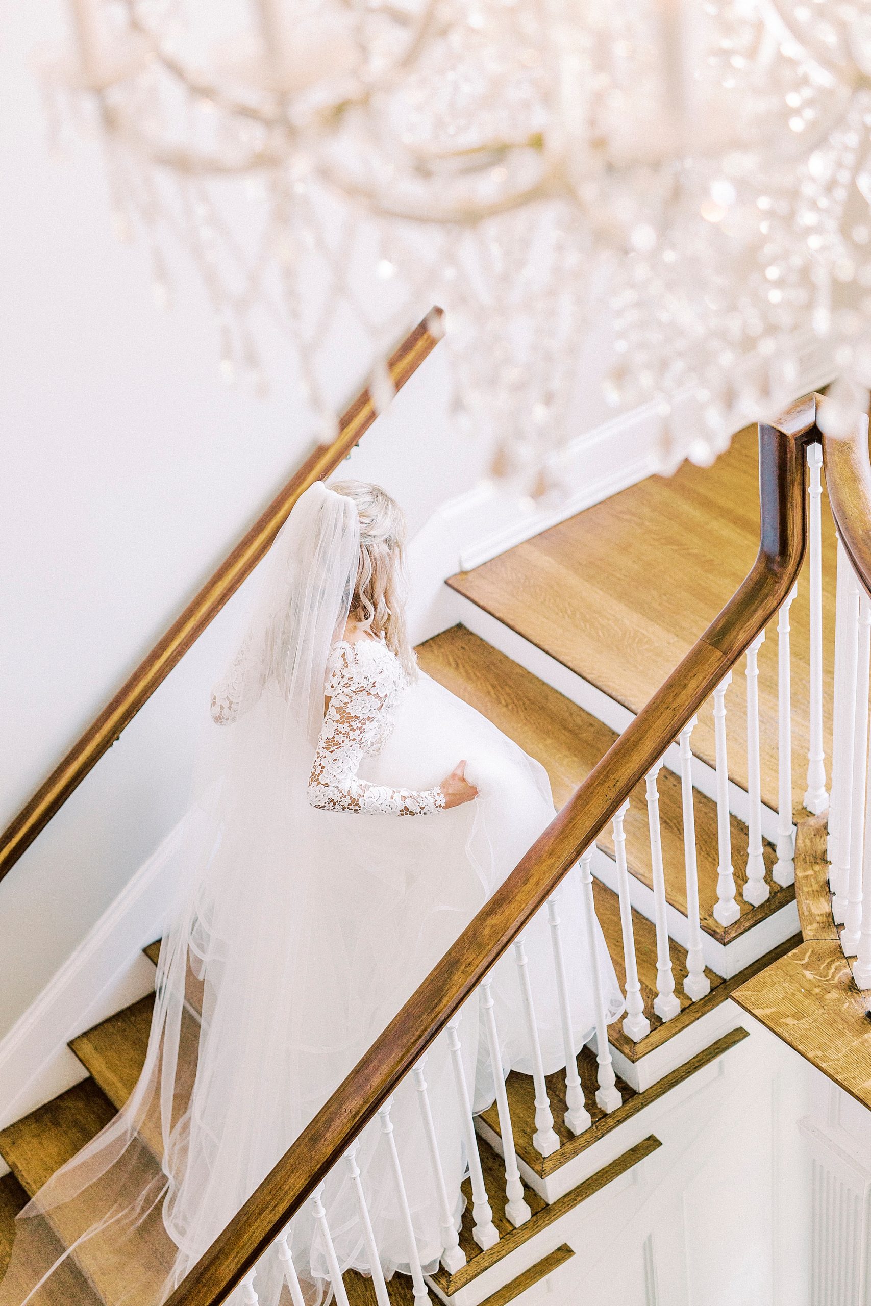bride walks up steps at Separk Mansion in hayden olivia bridal gown