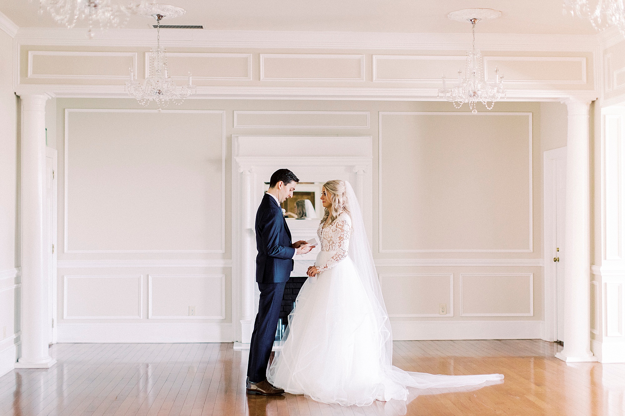 groom looks at bride during first look in Charlotte NC