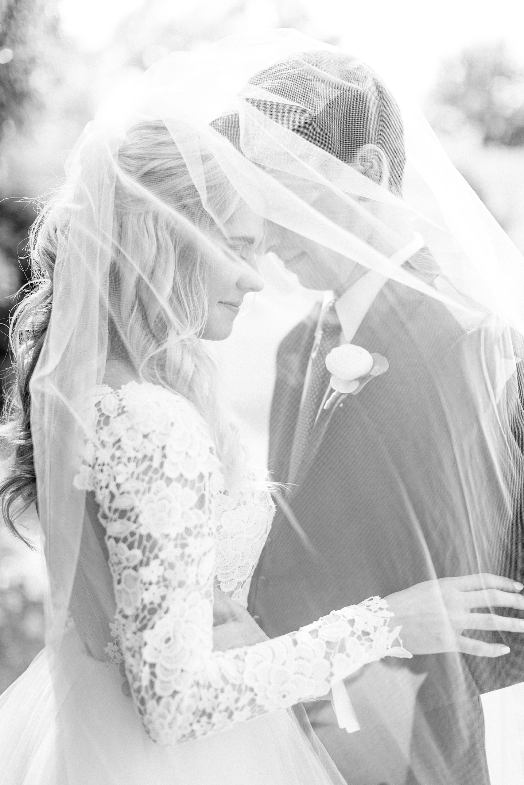 bride and groom hug under veil at Separk Mansion