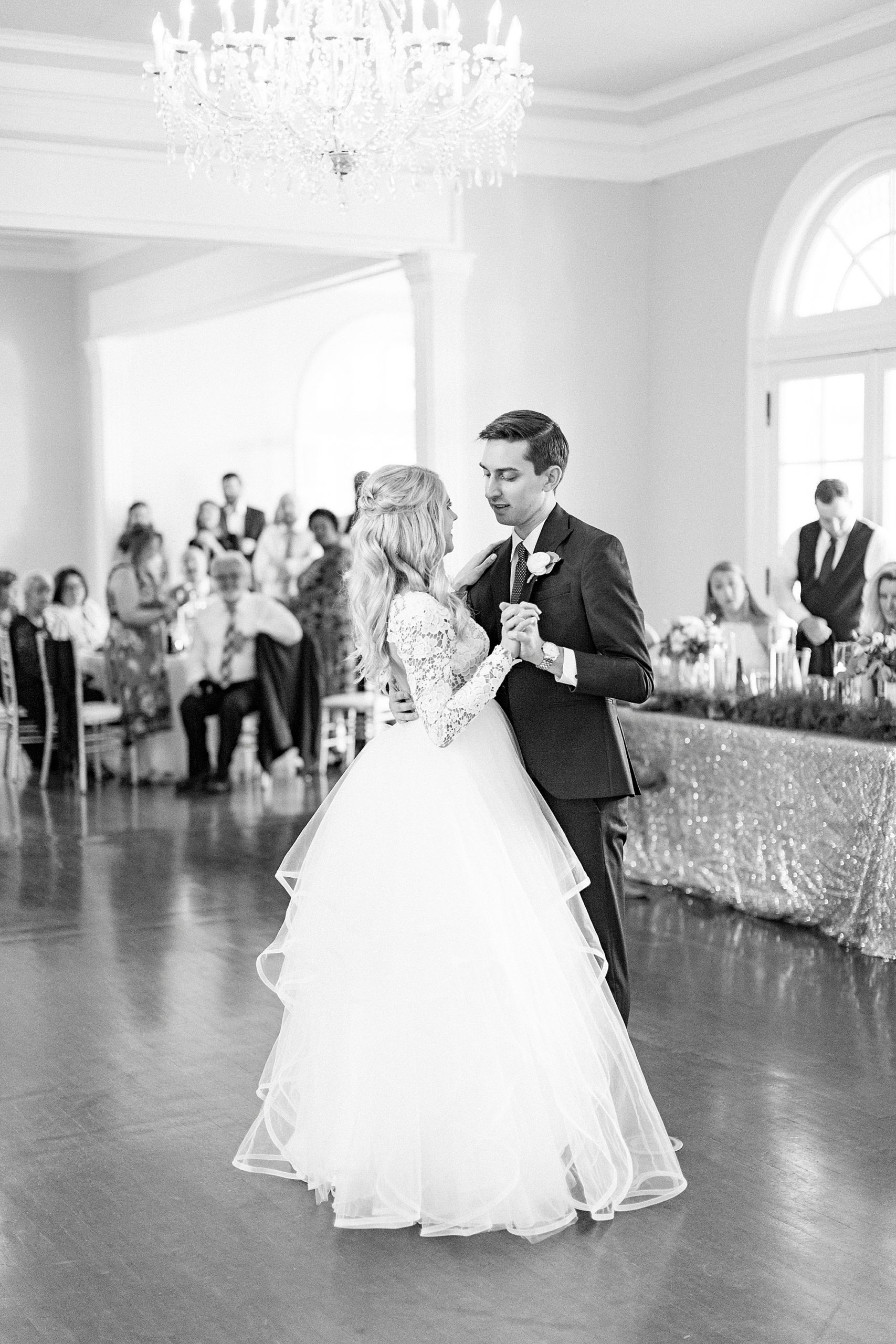 groom dances with bride in Hayden Olivia bridal gown