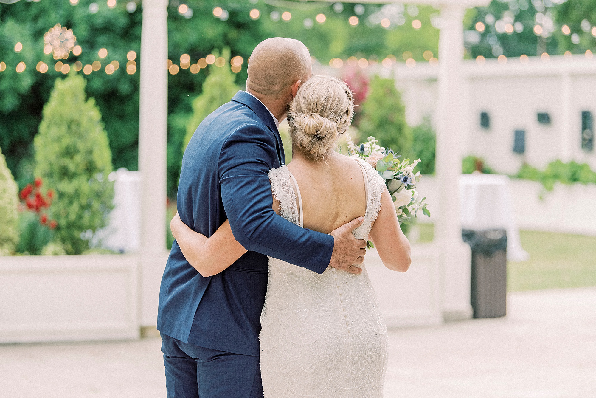 bride and groom hug after ceremony