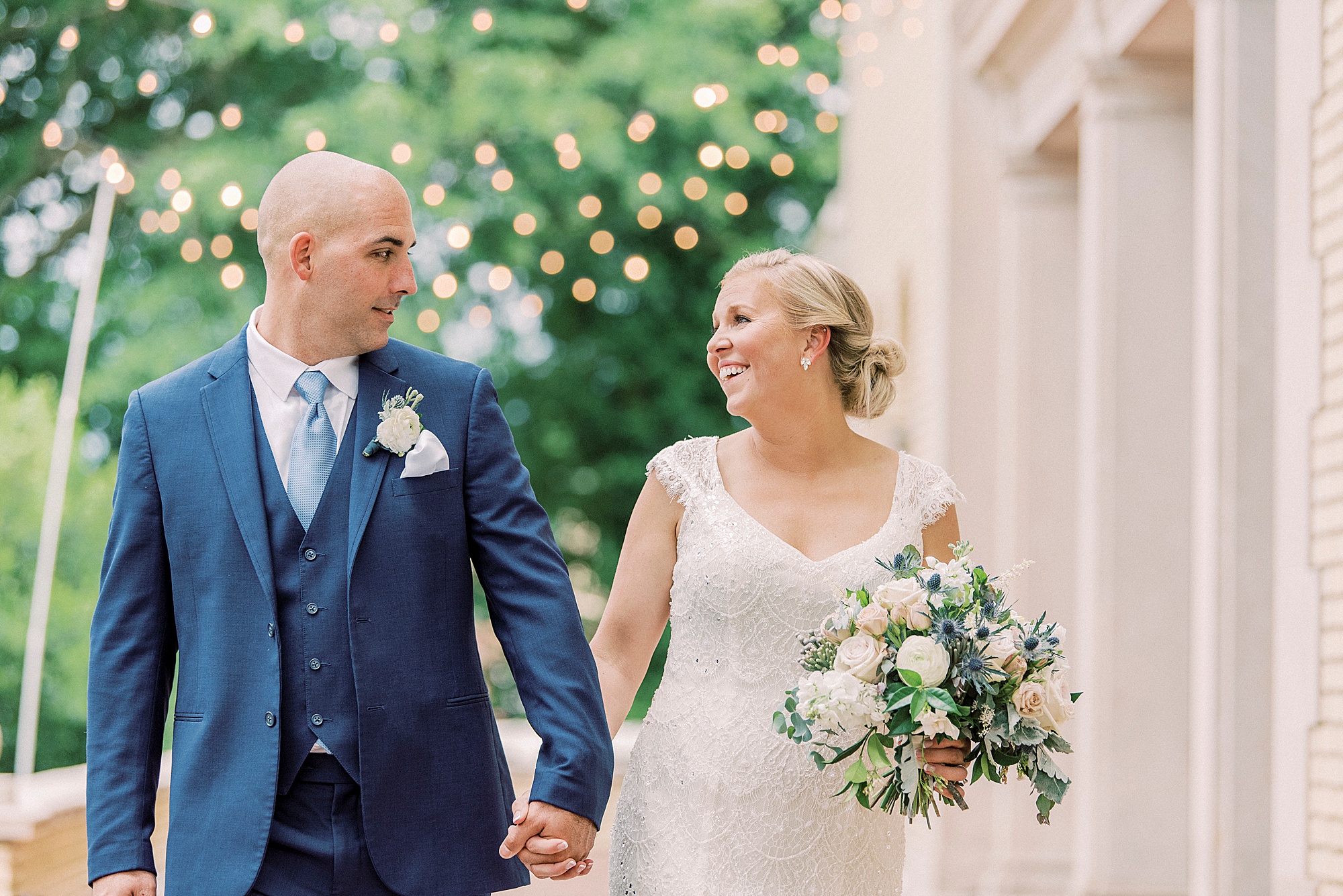 bride and groom hold hands walking through gardens of Separk Mansion