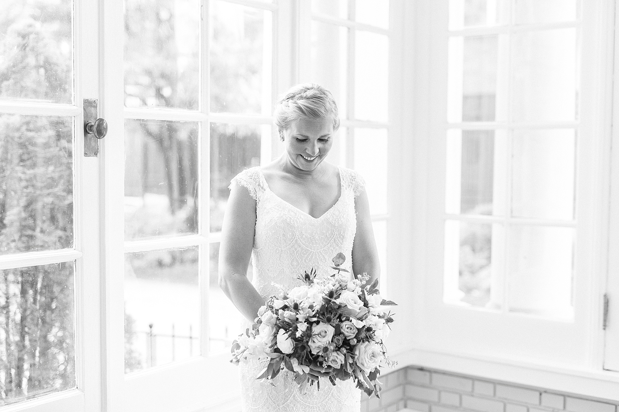 bride holds bouquet inside patio room at Separk Mansion