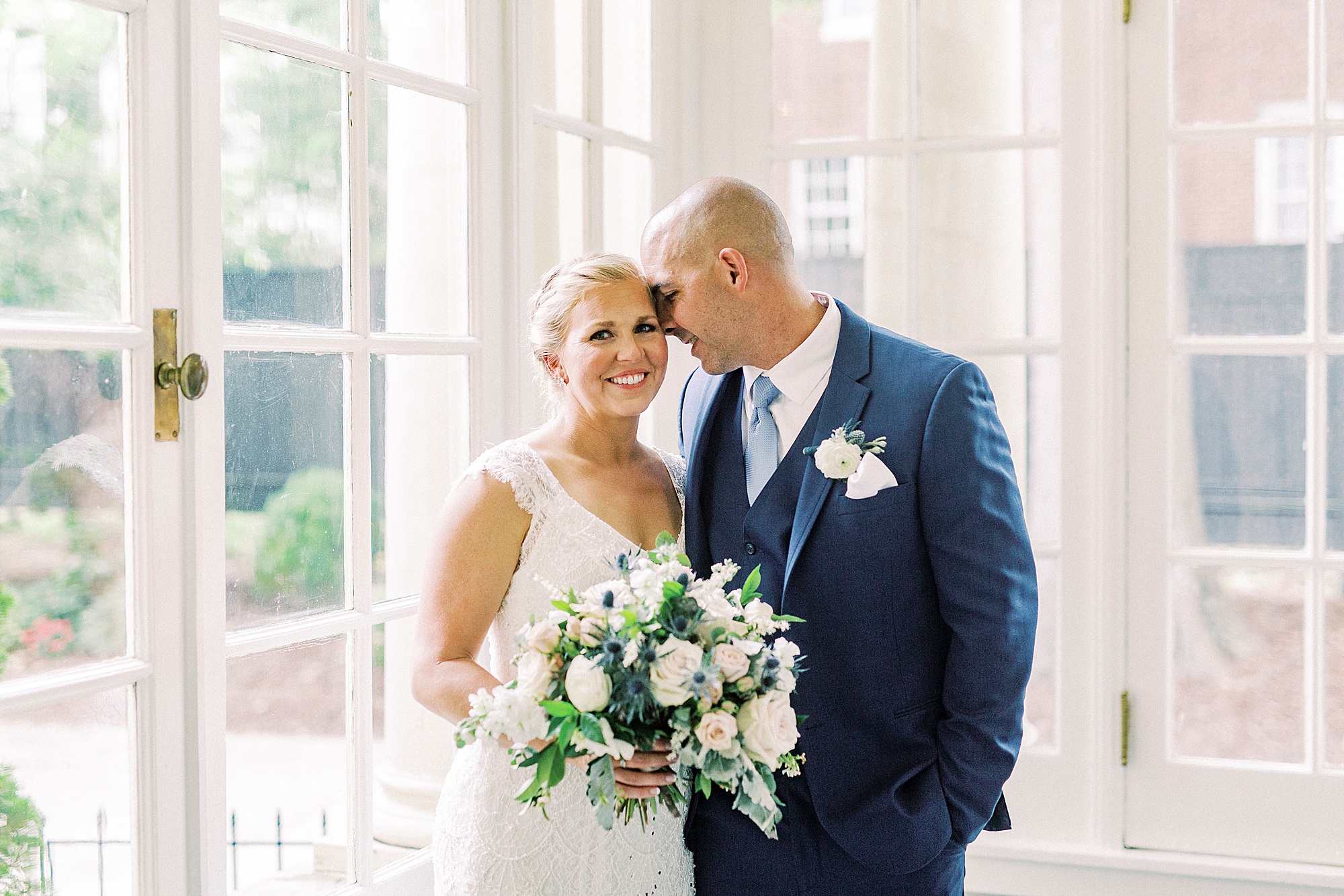 groom nuzzles bride's forehead in patio at Separk Mansion
