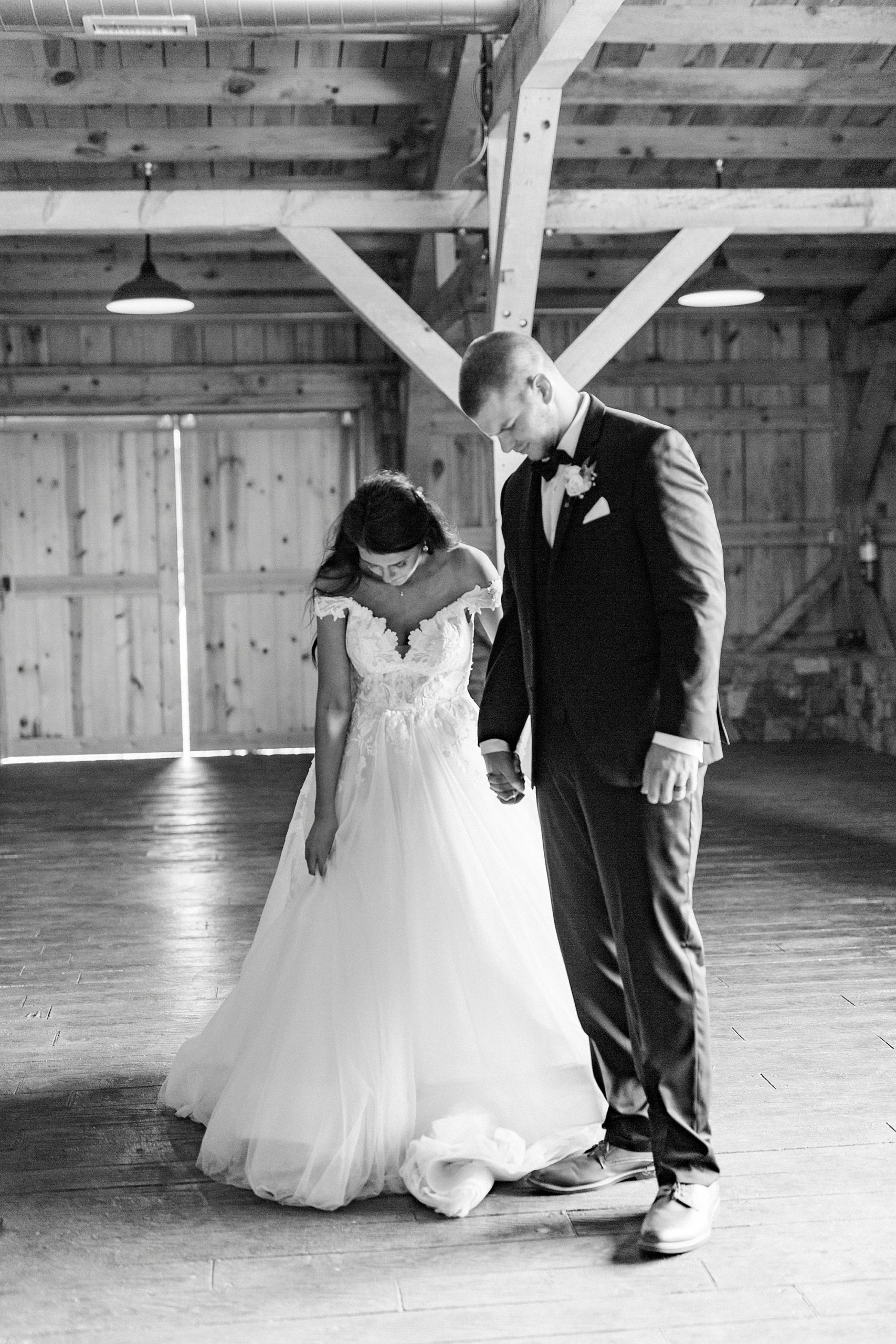 bride and groom pray during NC wedding reception