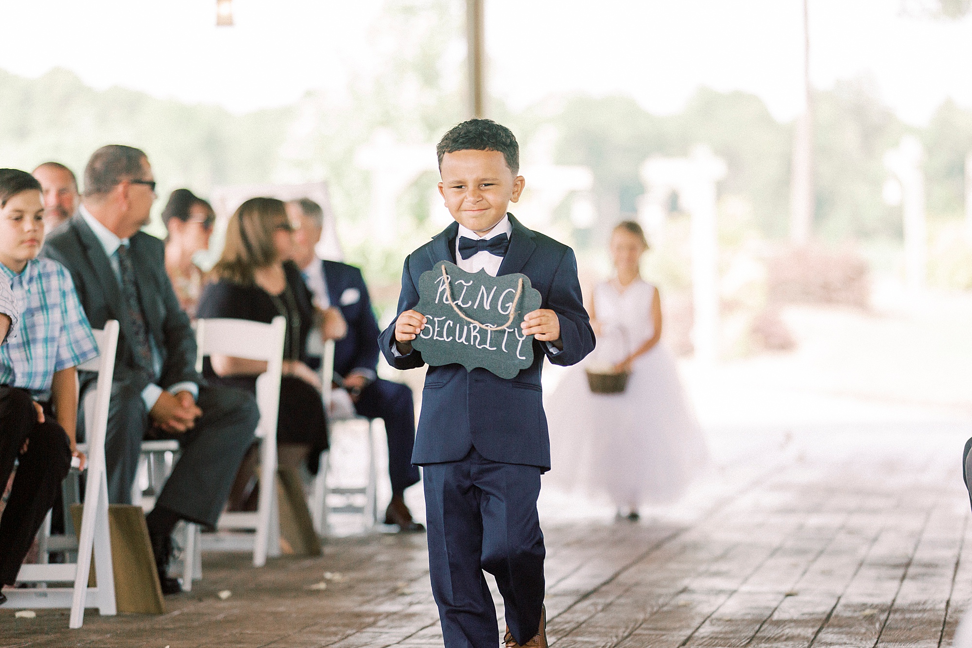 ring bear walks down aisle