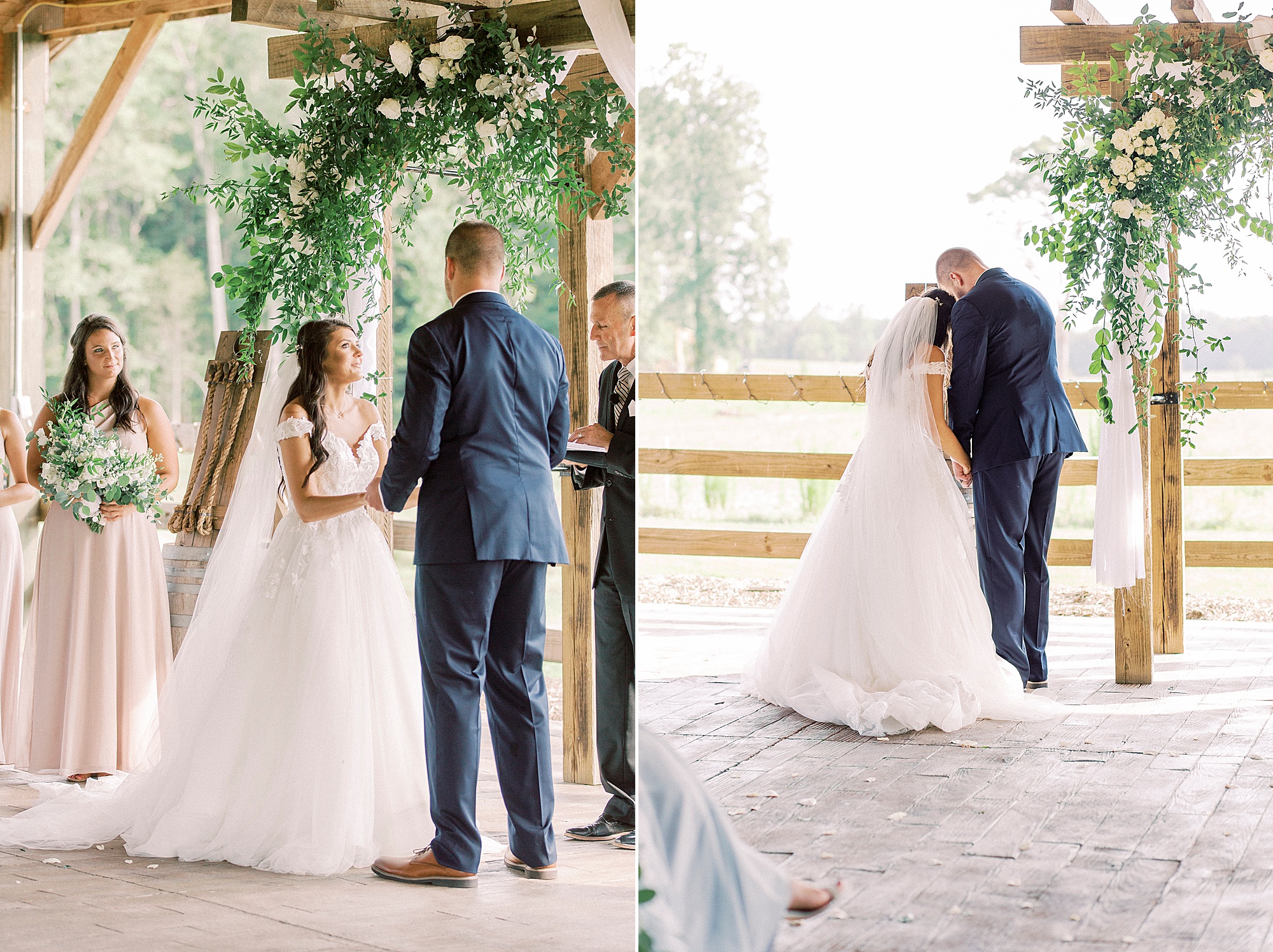 couple prays during rustic wedding ceremony by wooden cross at The Farmstead