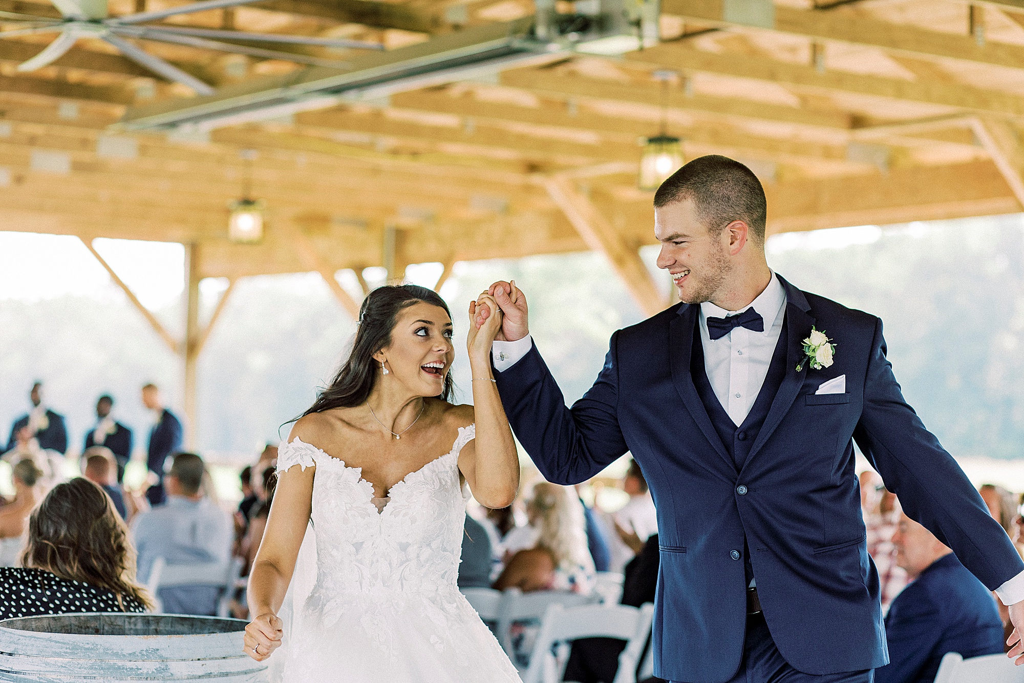 newlyweds cheer leaving wedding ceremony