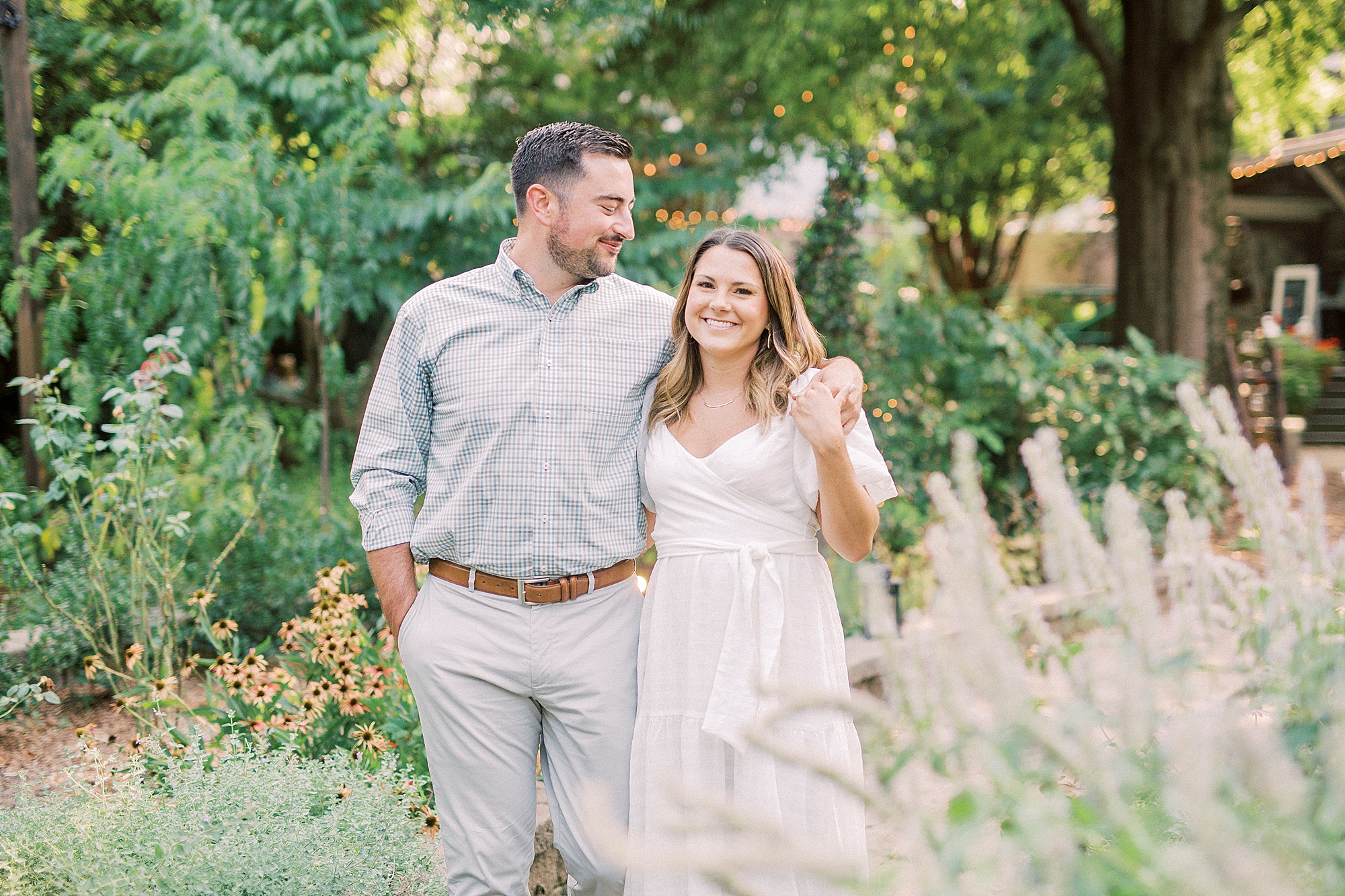 Charlotte couple walks through rose garden