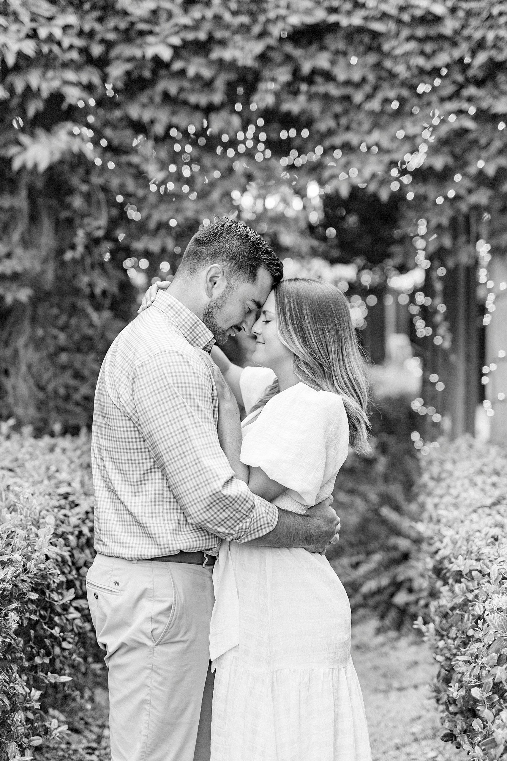 bride and groom pose touching noses in McGill Rose Garden