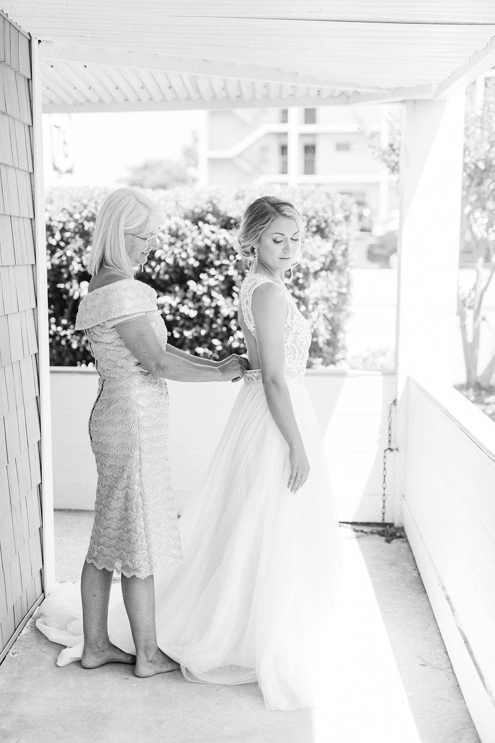 bride and mom prepare for Oceanic Restaurant wedding