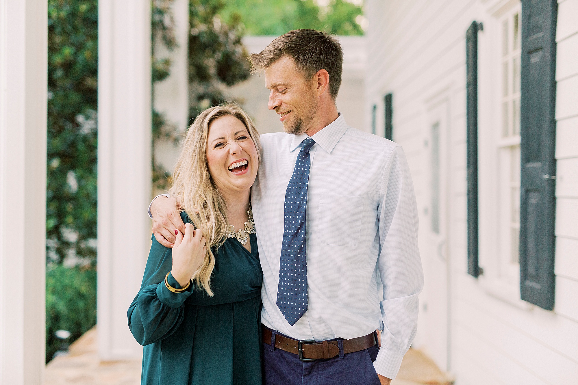 bride-to-be laughs with groom during engagement photos in Iron Station
