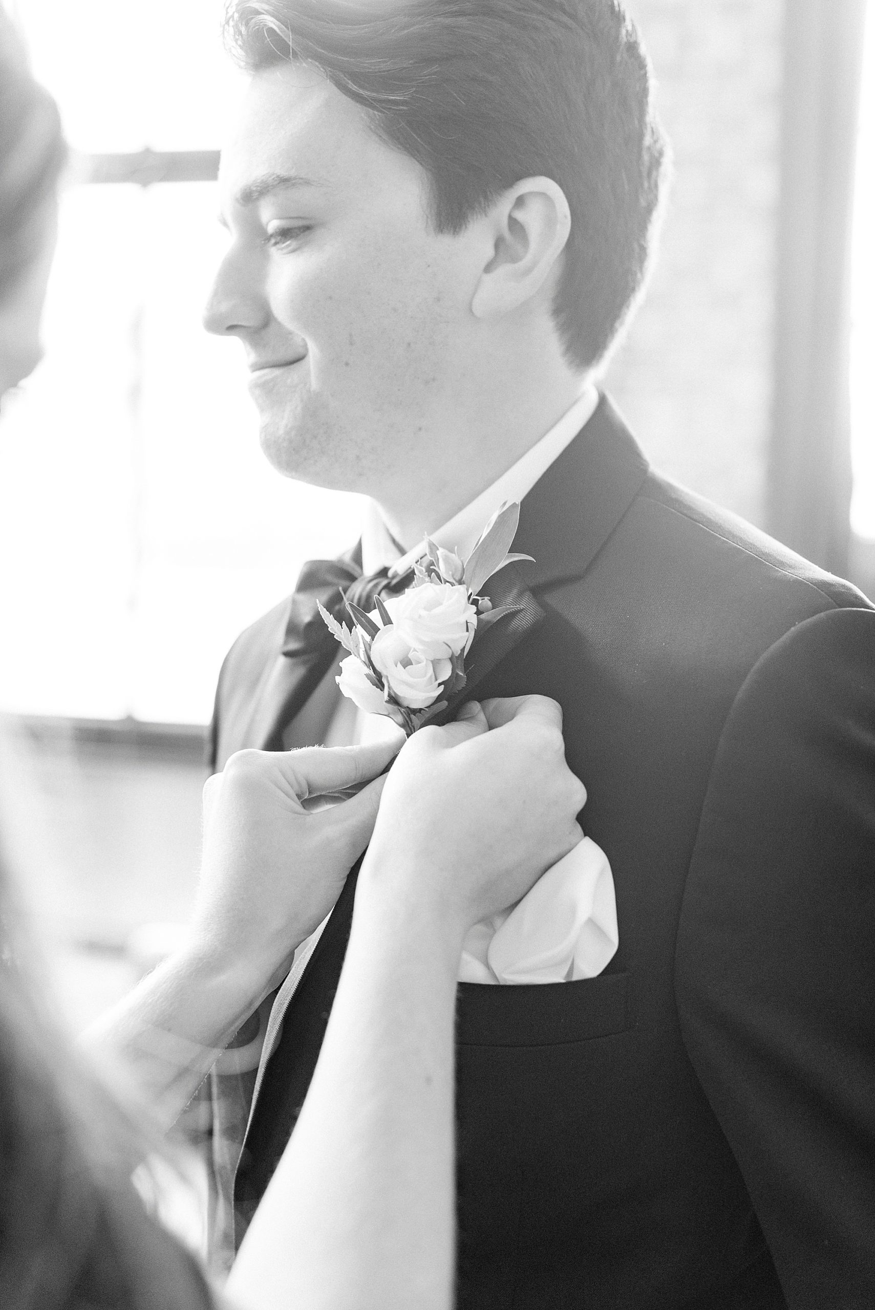 groom prepares for NC wedding day at Cadillac Service Garage