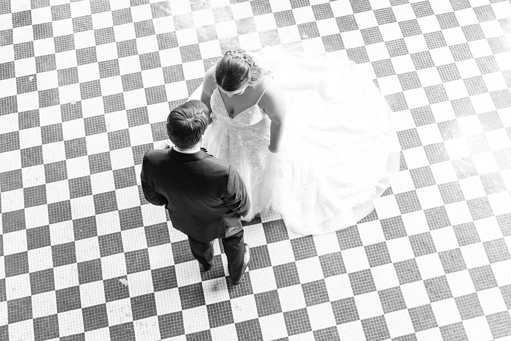 bride and groom have first look at Cadillac Service Garage