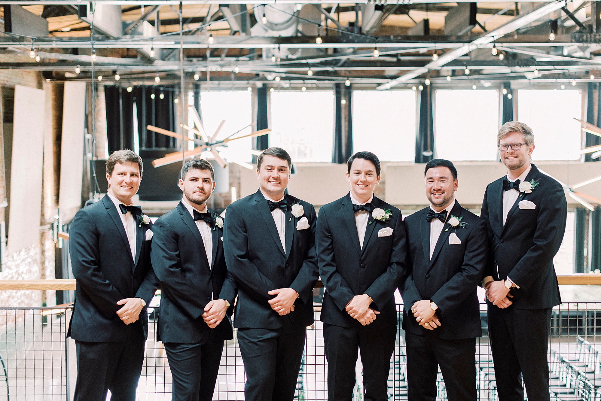 groom and groomsmen pose in Greensboro NC