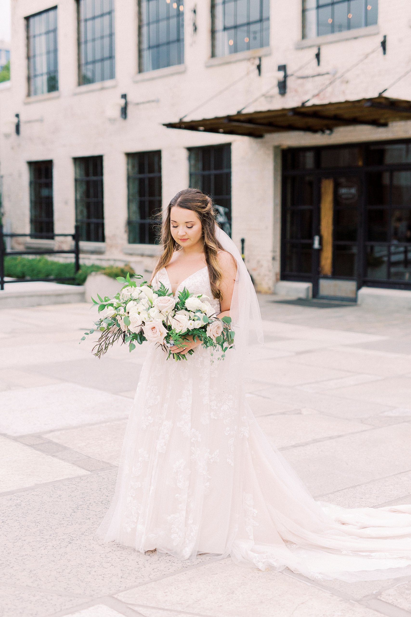 bride portraits outside the Cadillac Service Garage