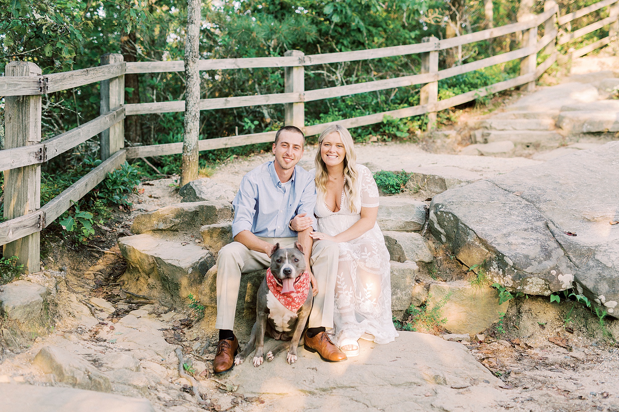 bride and groom pose with dog during Mount Airy engagement session