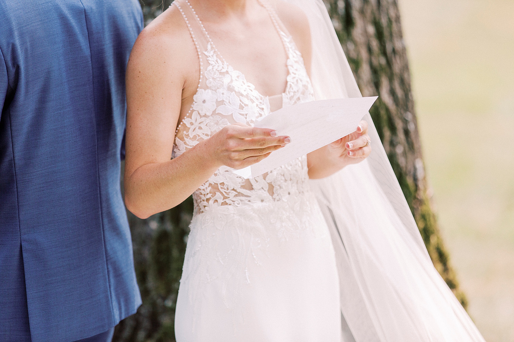 bride and groom read letters during first touch