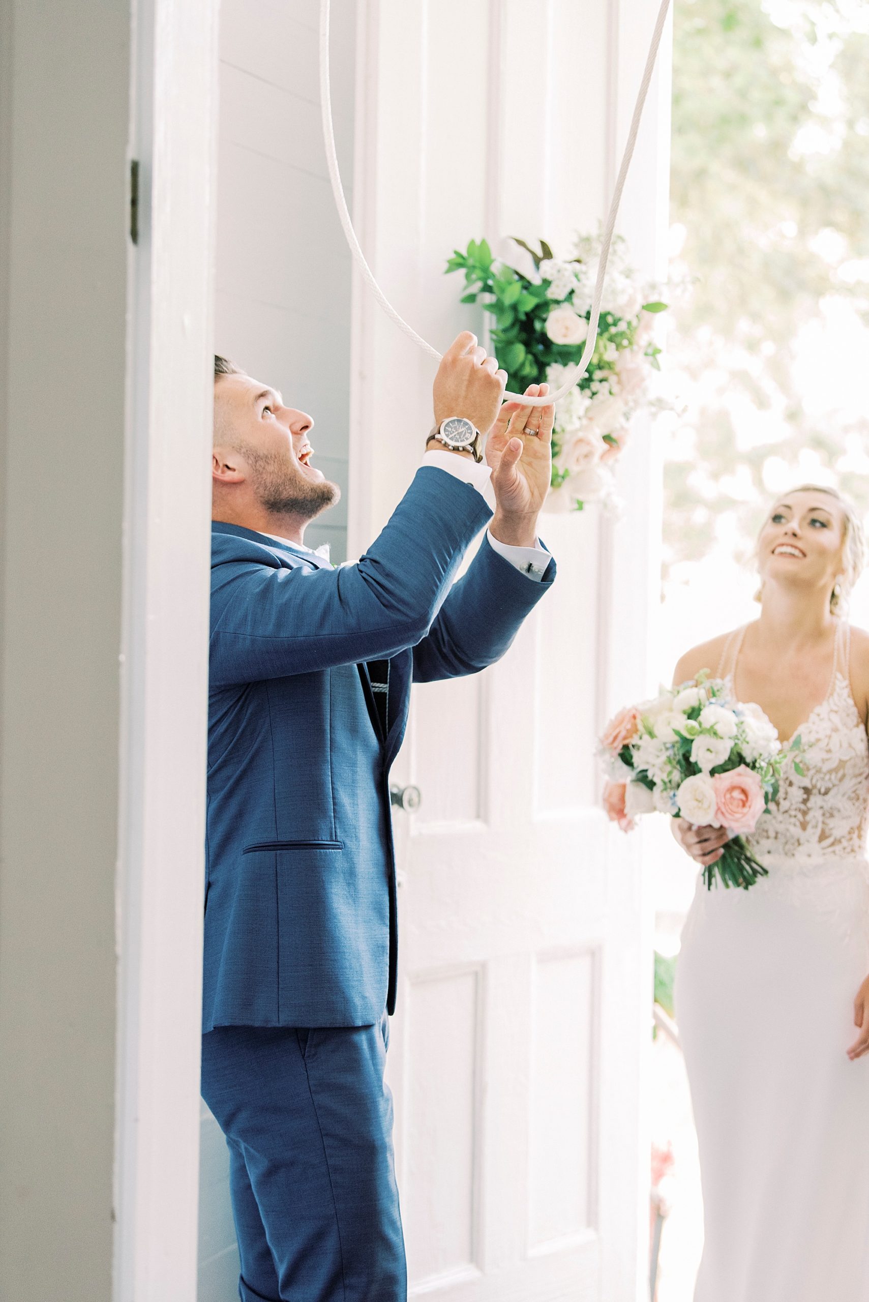 groom cheers after traditional church wedding in Winston-Salem NC