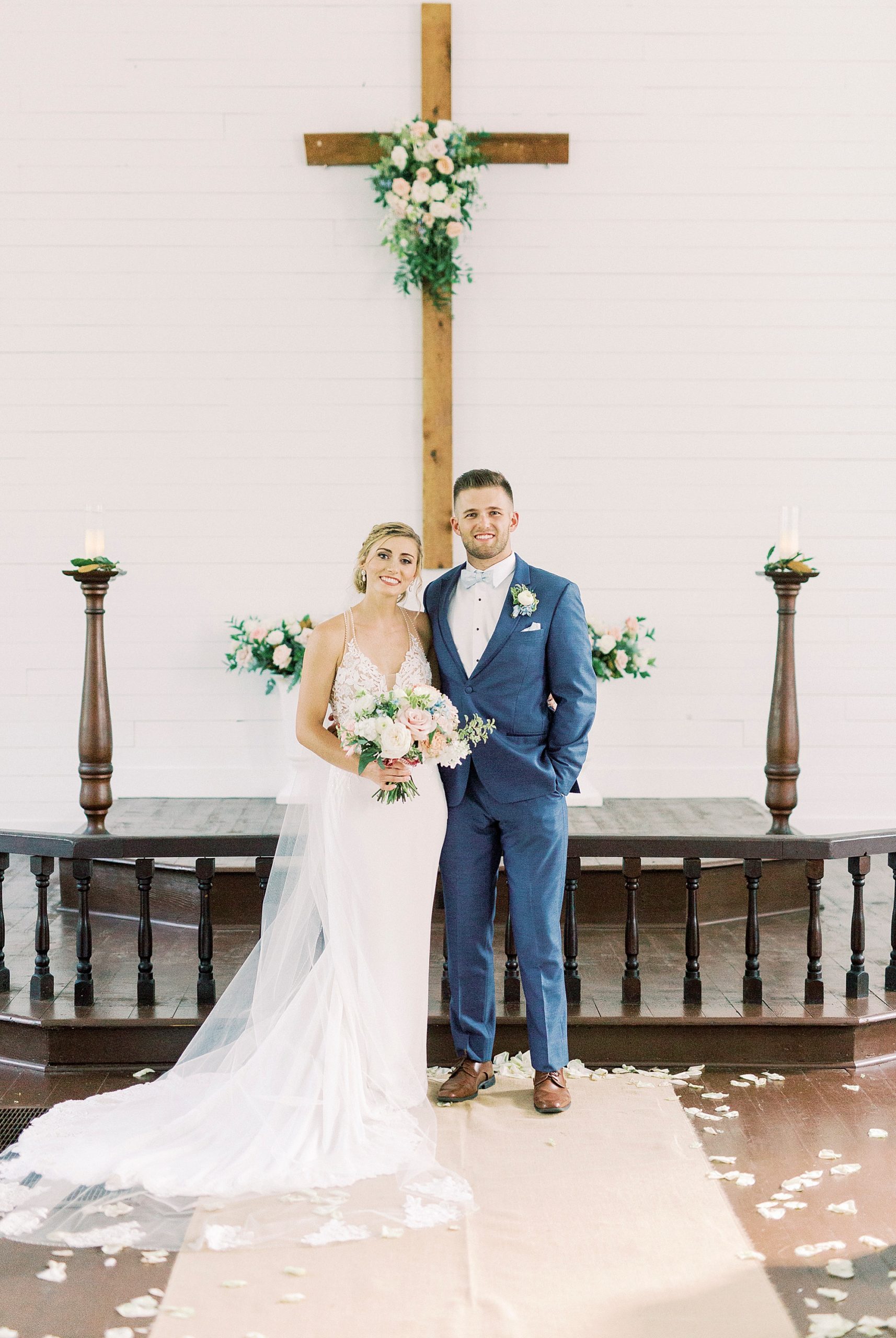 bride and groom pose by alter at Yadkinville NC church