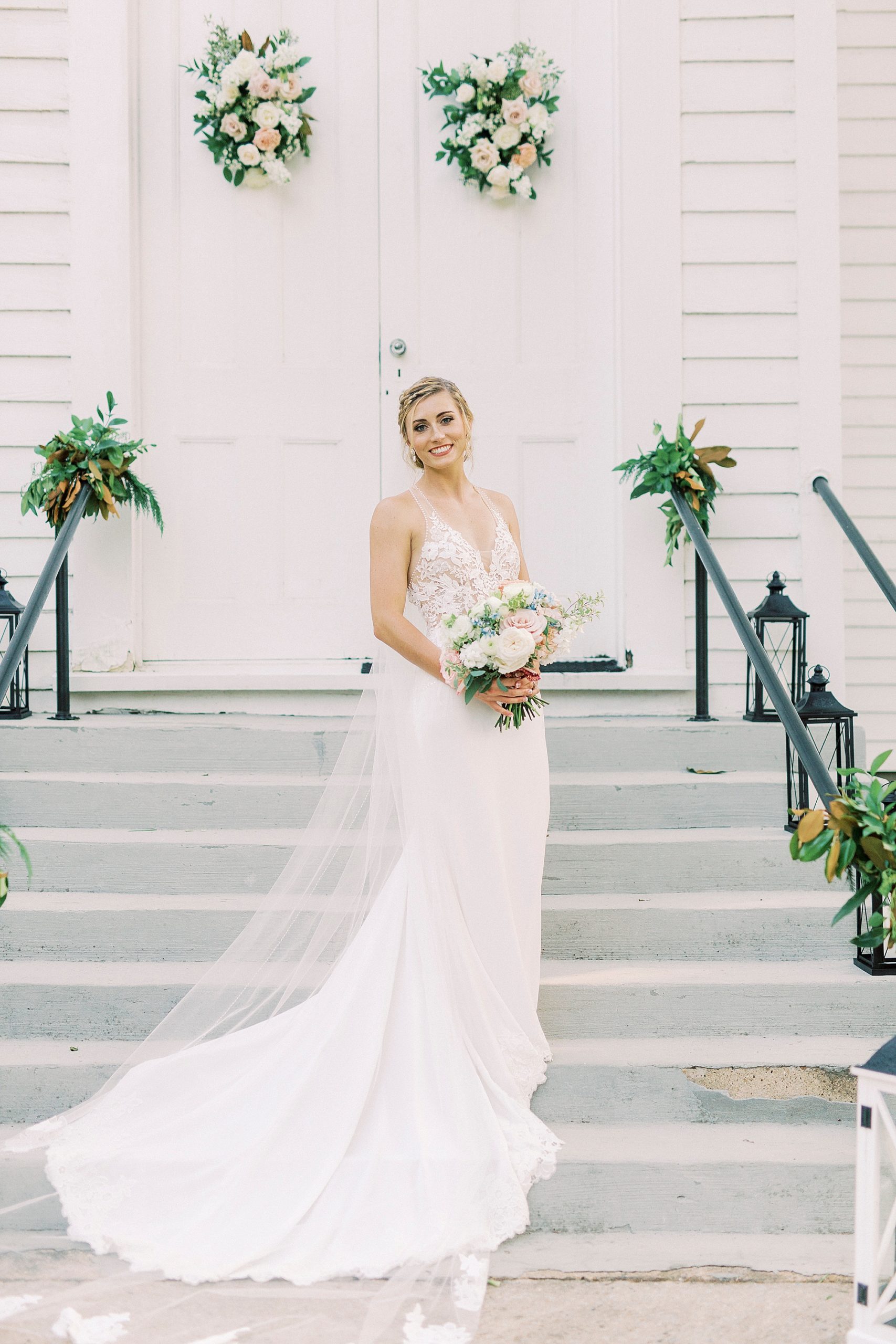 bride stands on steps of Winston-Salem NC church