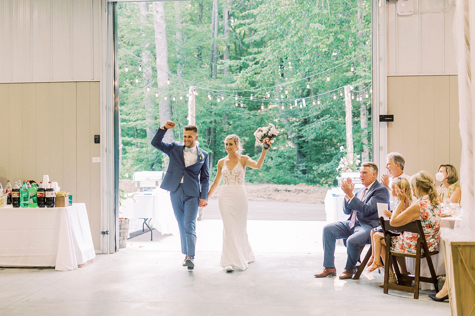bride and groom enter wedding reception