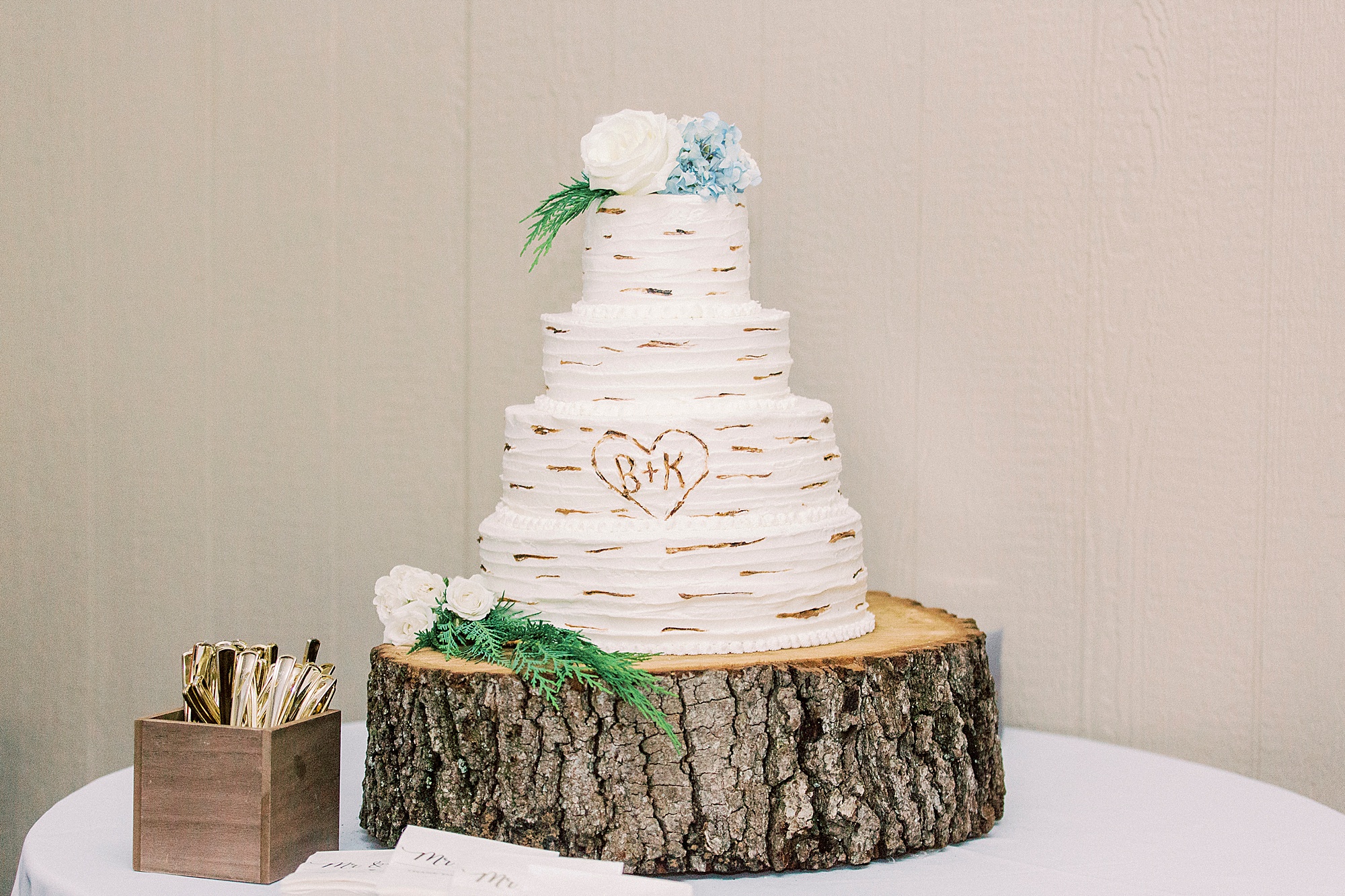 tiered wedding cake with rustic details
