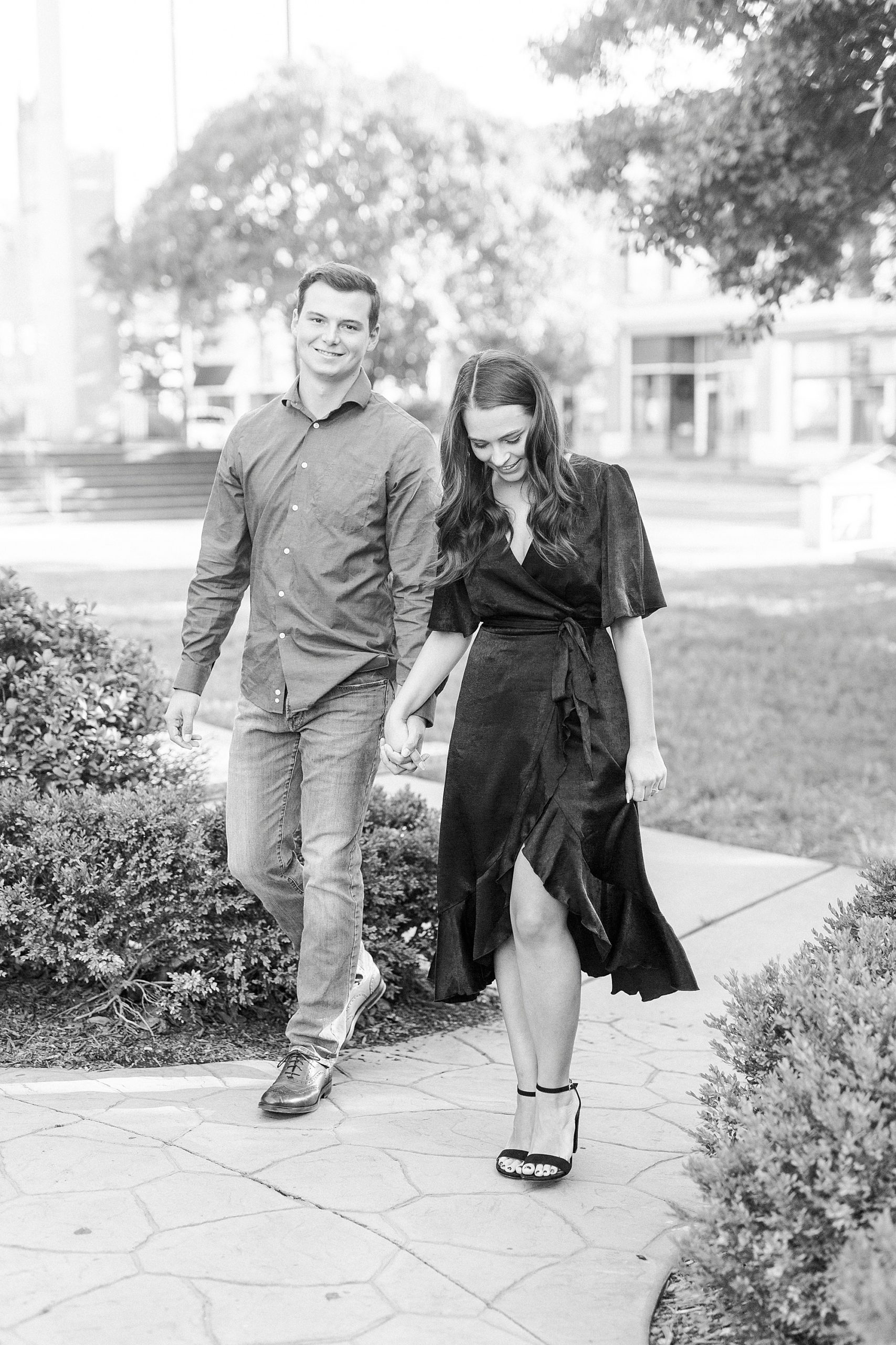 bride laughs while walking with groom