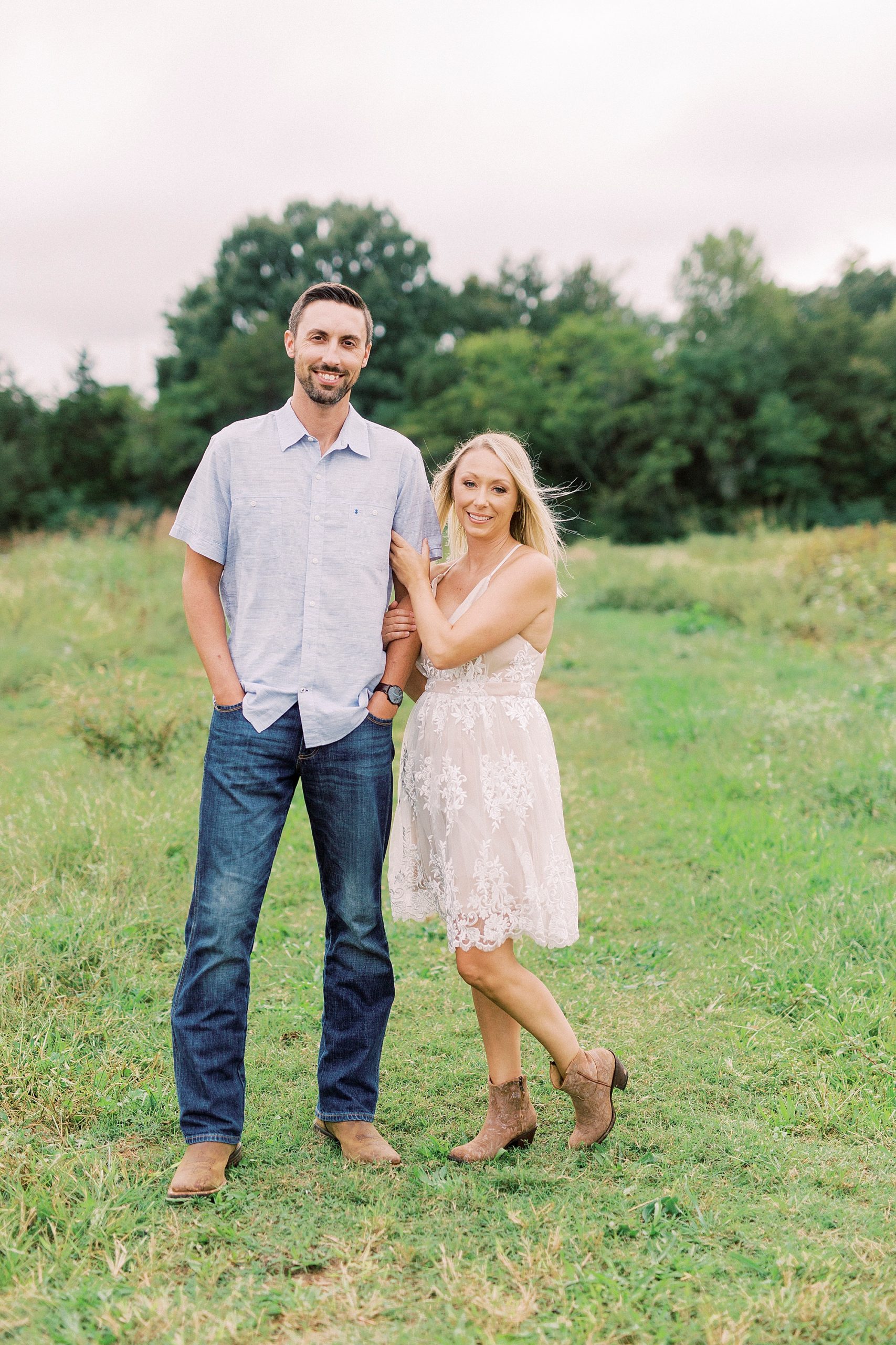 bride leans on groom during fall engagement photos