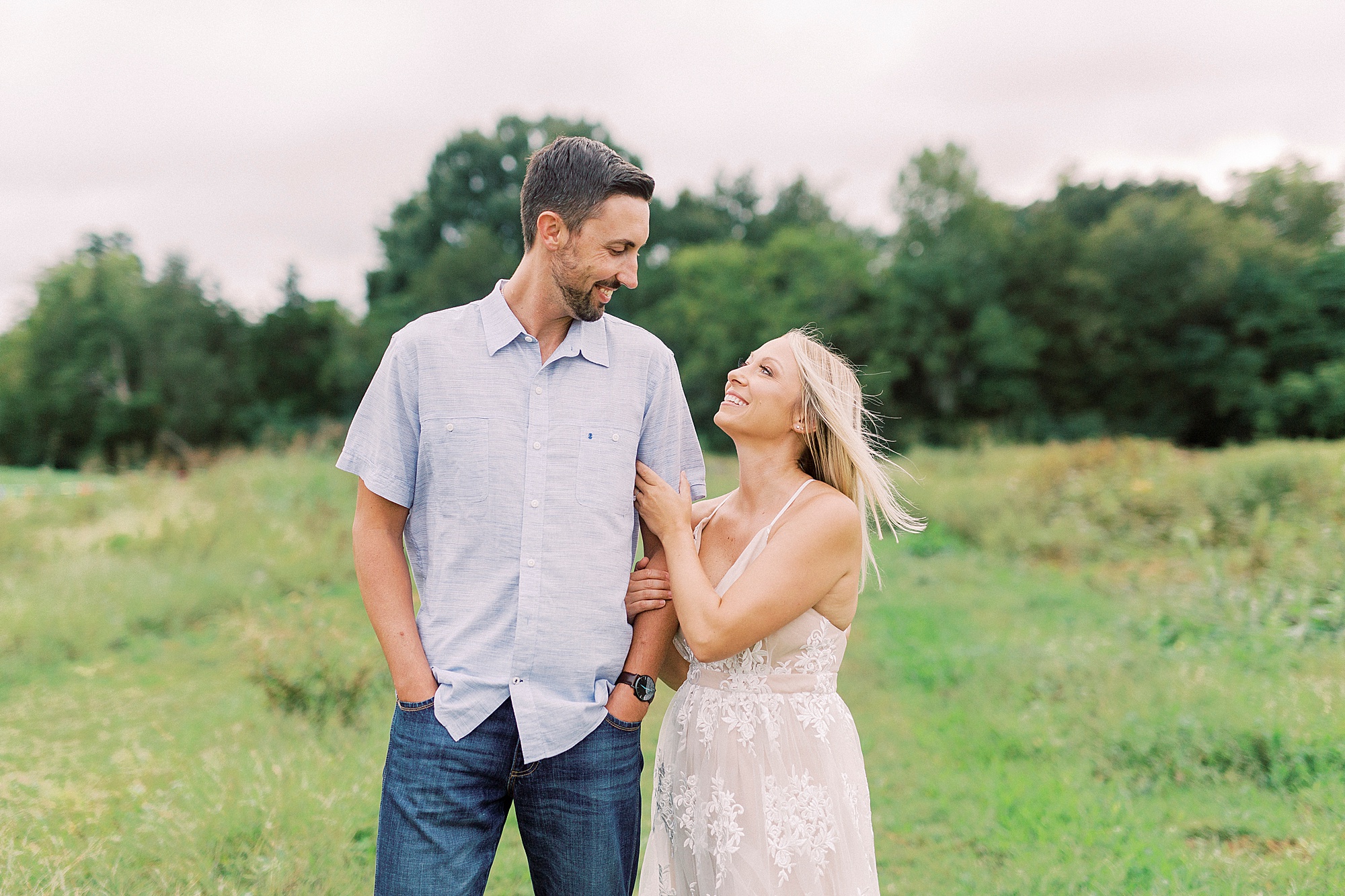 bride looks up at groom during portraits in Charlotte NC