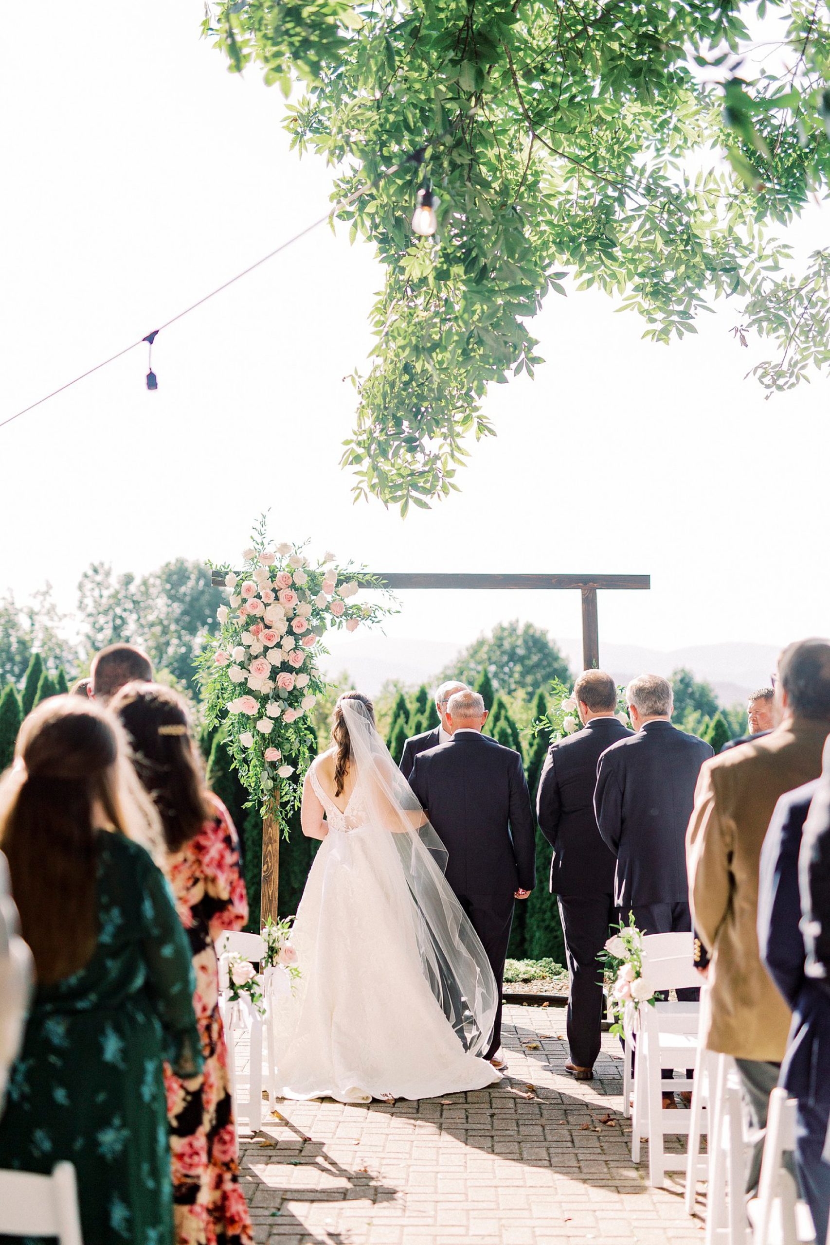 dad gives bride away during Blowing Rock NC wedding ceremony